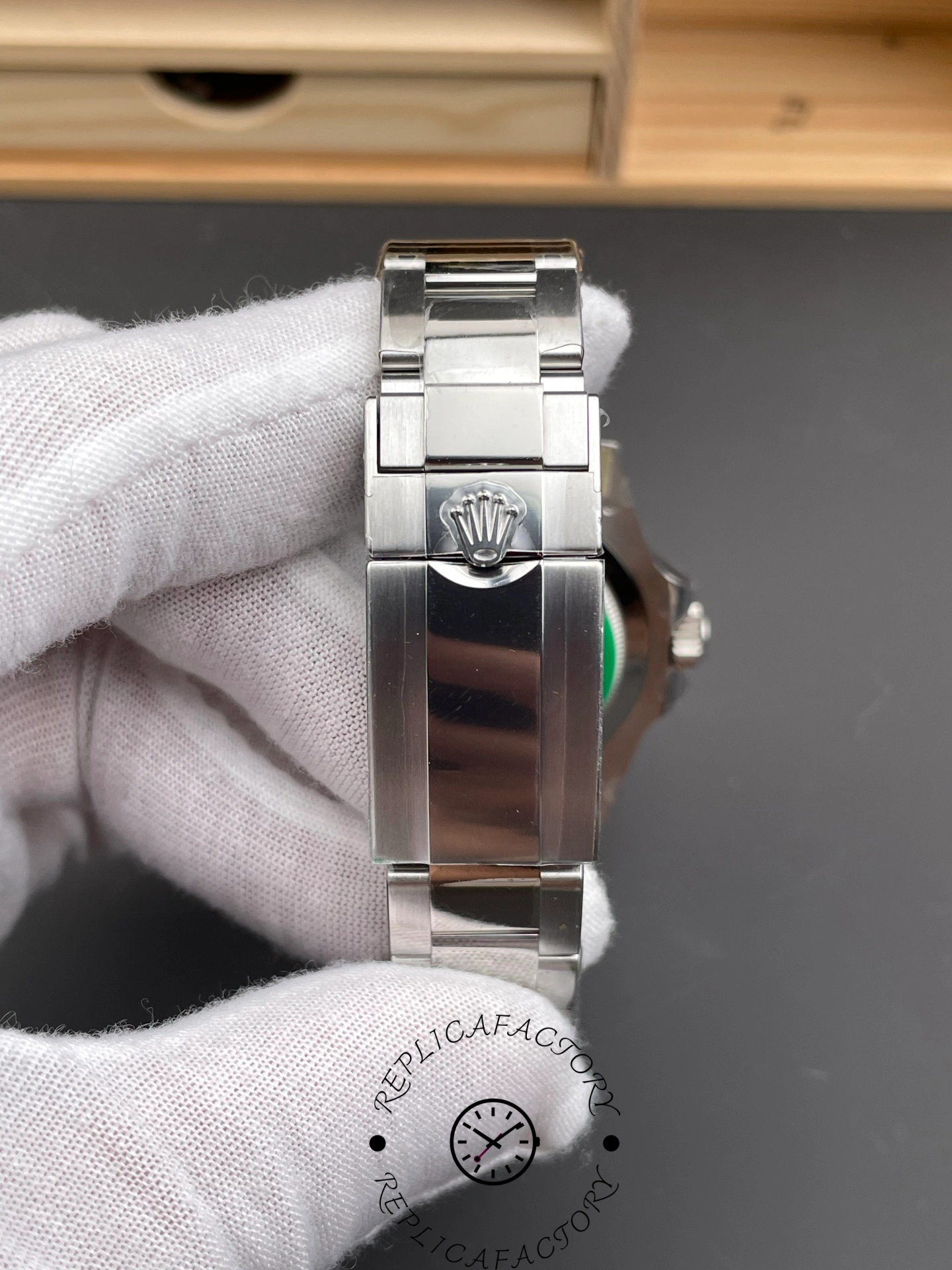 Bracelet clasp close-up of the Rolex GMT-Master II 126719BLRO-0002 showing embossed crown logo.