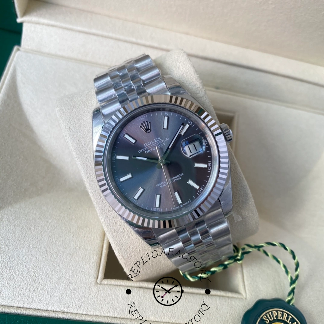 Angled view showing Rolex Datejust 126334-0014 grey dial with fluted bezel in box.