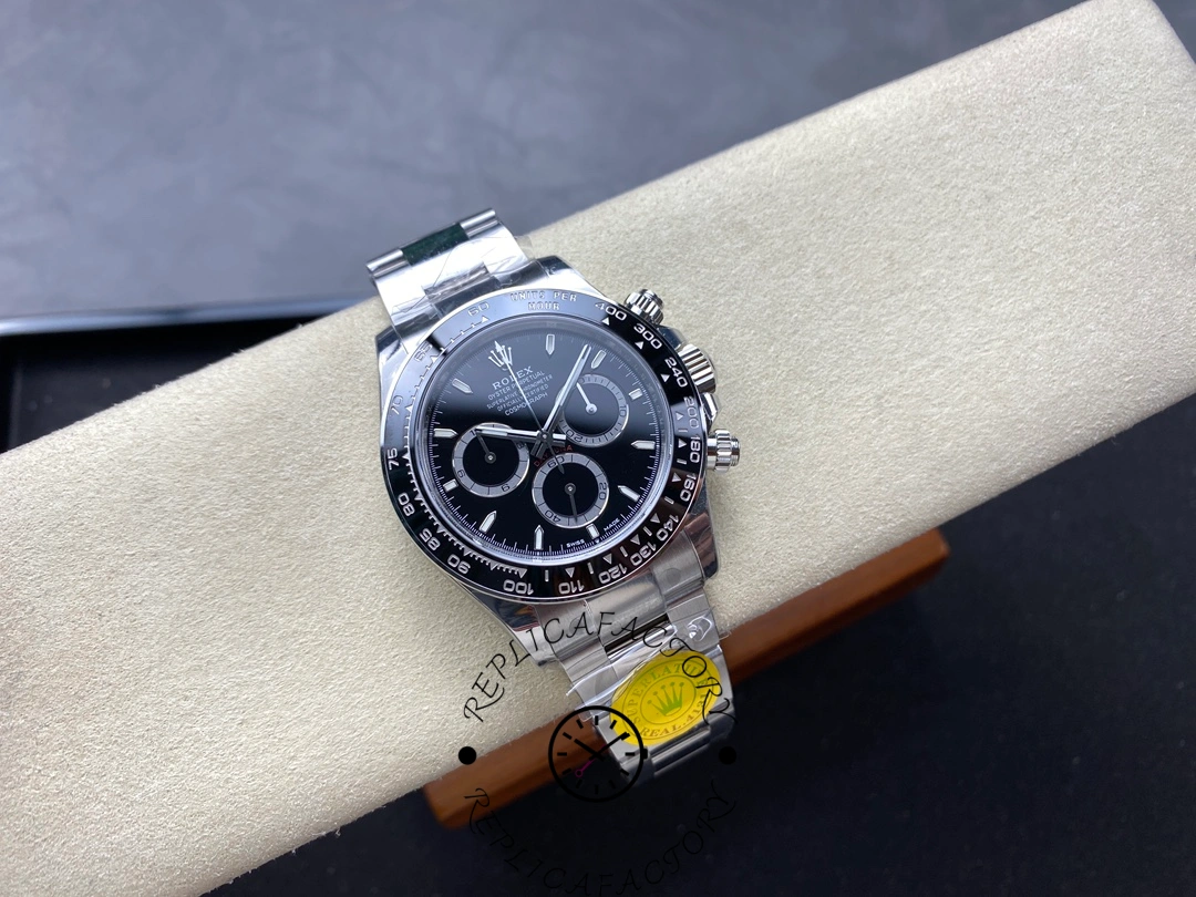 Full front layout of the Rolex Cosmograph Daytona 116500LN on display cushion showing the entire watch from top to bracelet.