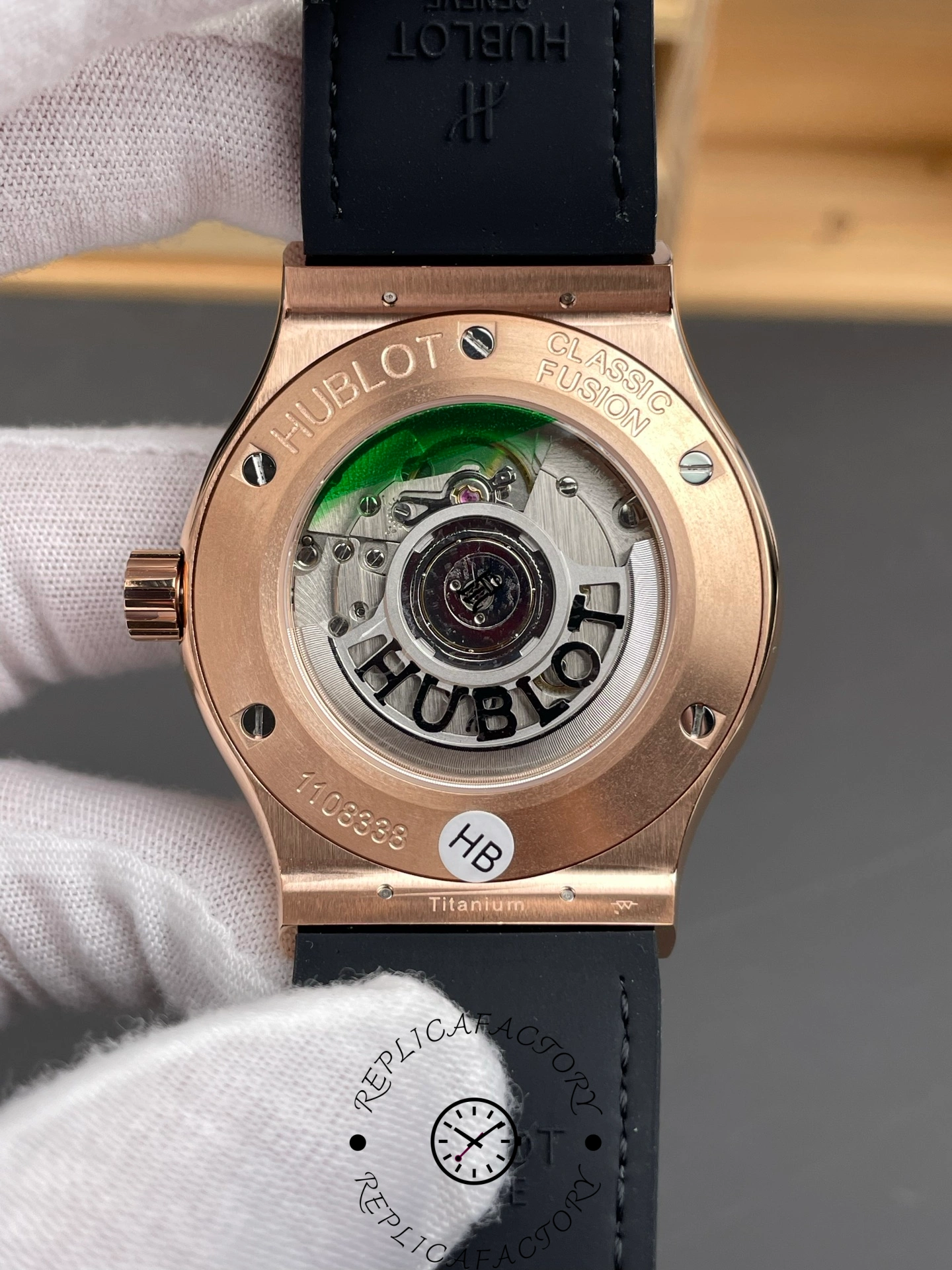 Caseback showing automatic movement through sapphire window with Hublot engraving.