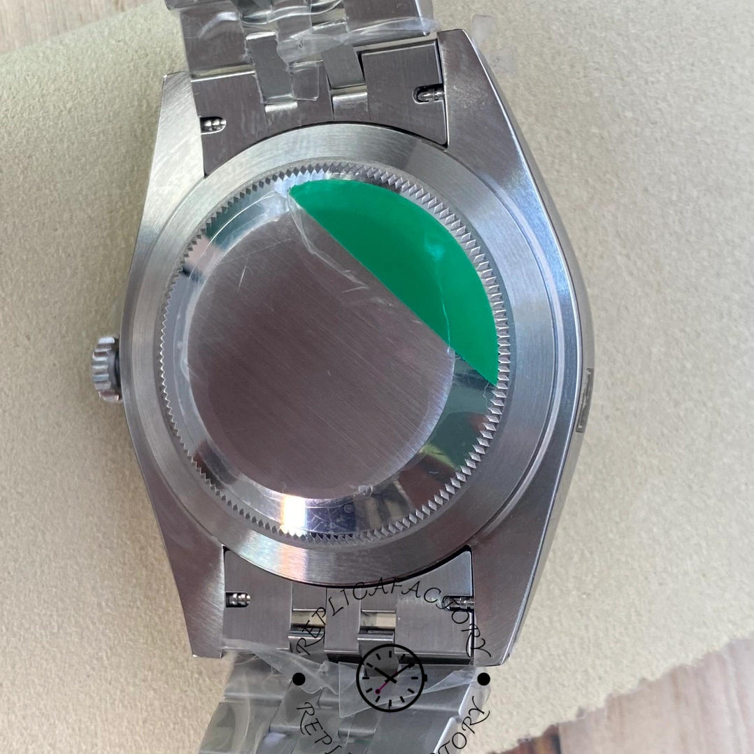 Caseback of Rolex Datejust 126334-0014 replica showing green protective sticker.