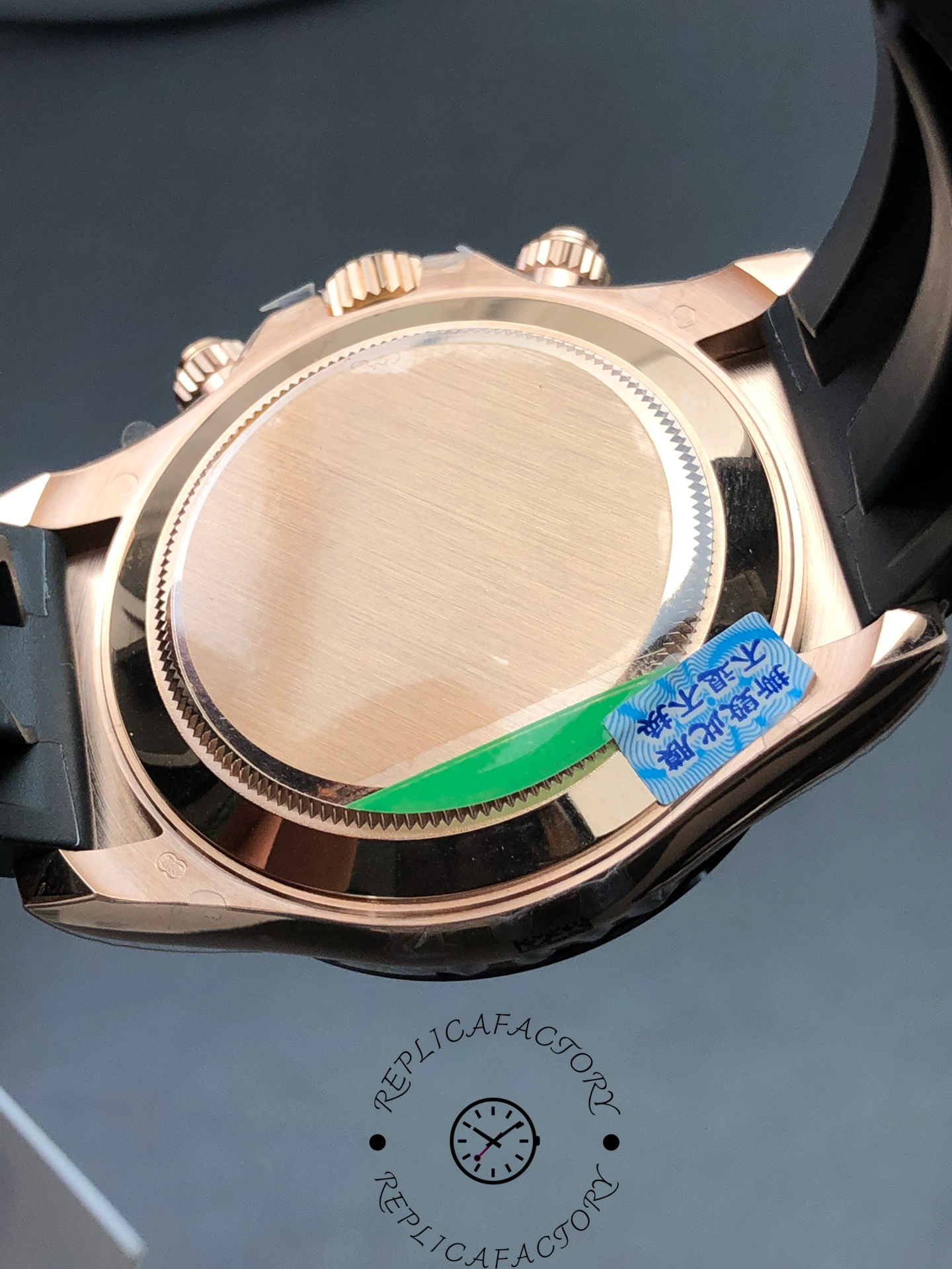 Caseback of Rolex Cosmograph Daytona 126515LN-0010 replica showing brushed Everose finish and green sticker.