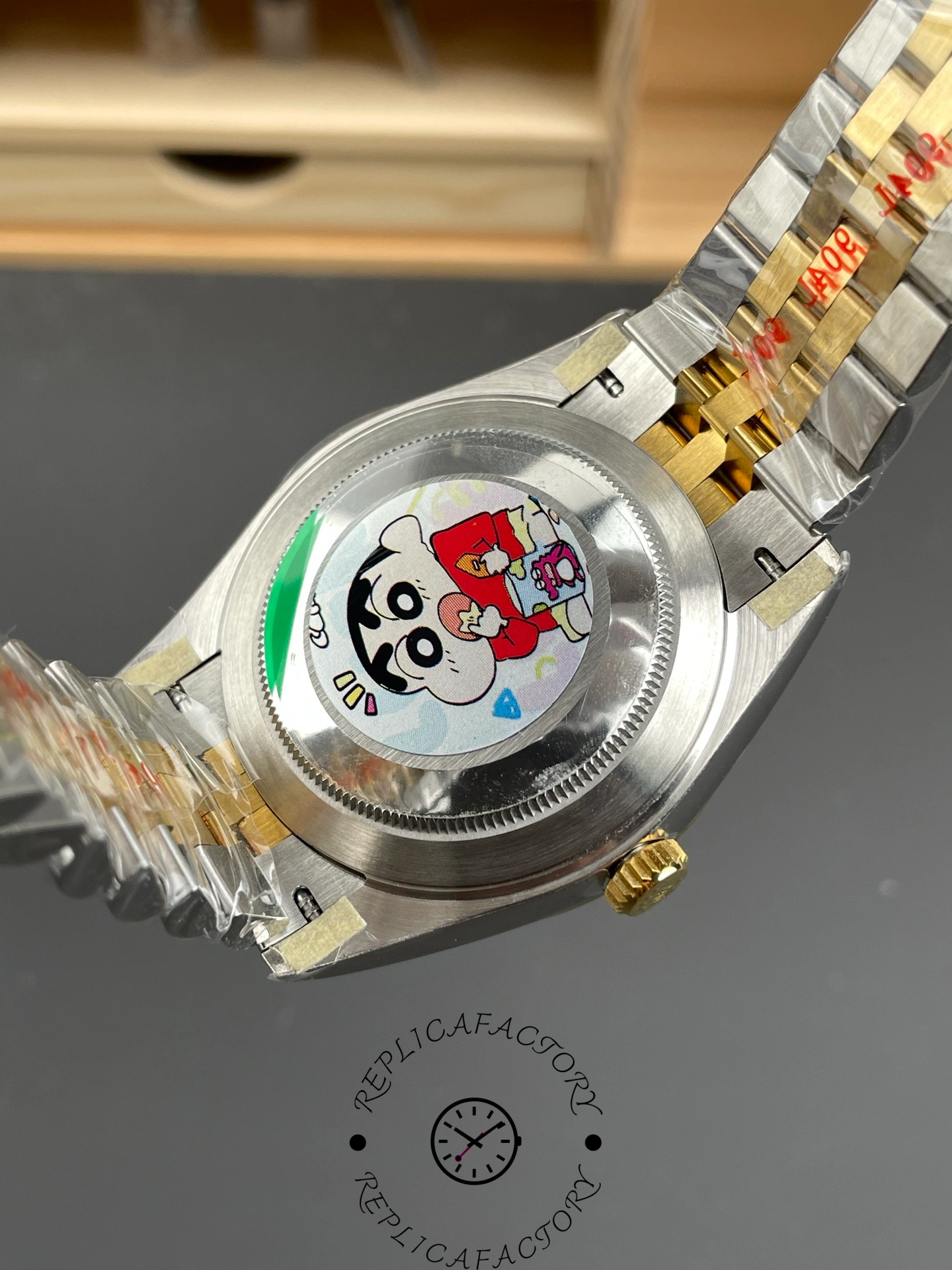 Caseback view of ARF Factory Rolex Datejust 41 ref. 126333-0010 with protective cartoon sticker on steel back.