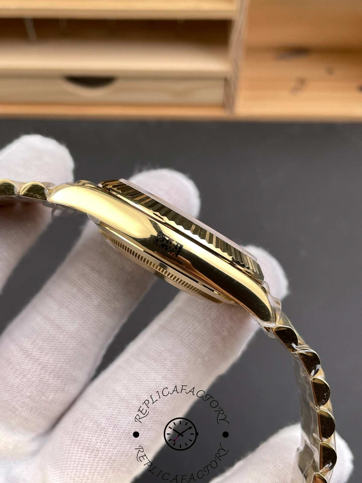 Opposite side view of RC Factory Rolex Day-Date 228238 showing case profile and bezel edge.