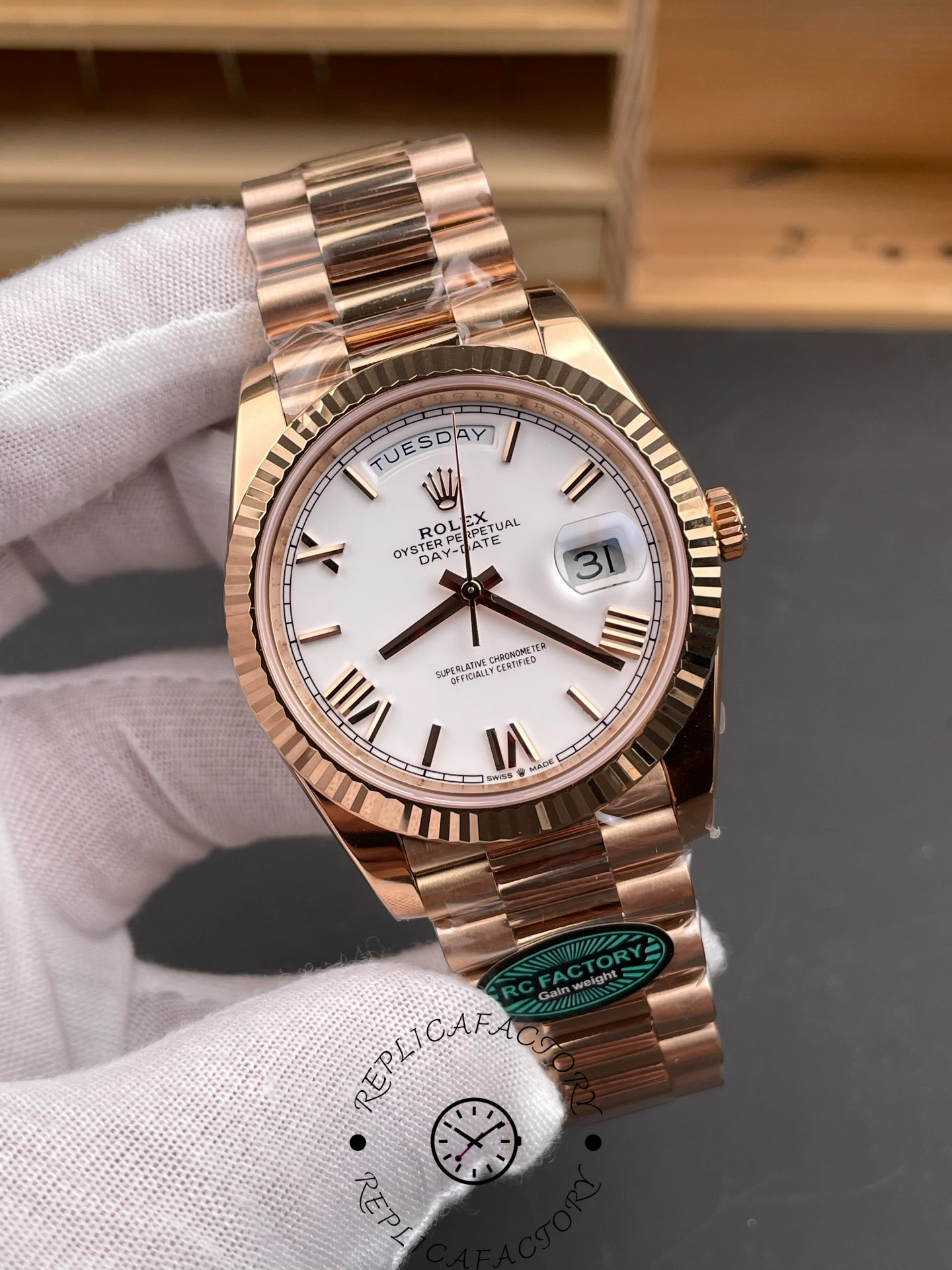 Angled front view of RC Factory Rolex Day-Date 228235 highlighting the fluted bezel and President bracelet.