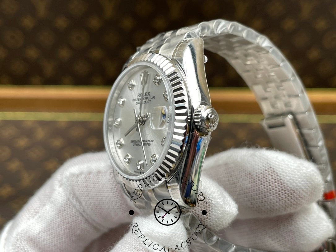 Crown side view of ReplicaFactory Rolex Datejust m278274-0030 with Rolex logo on screw-down crown.