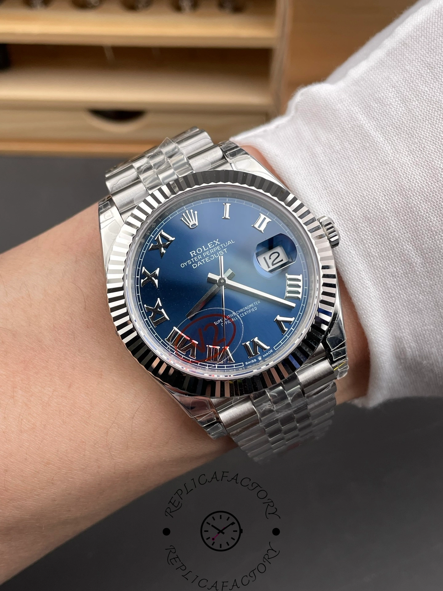Wrist shot of THB Factory Rolex Datejust 41 ref. 126334-0026 showing the blue Roman dial under natural light.