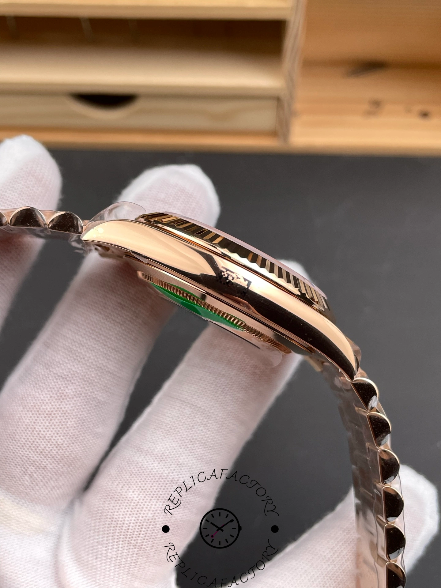 Opposite side view of RC Factory Rolex Day-Date 228235 showing case profile and bezel edge.