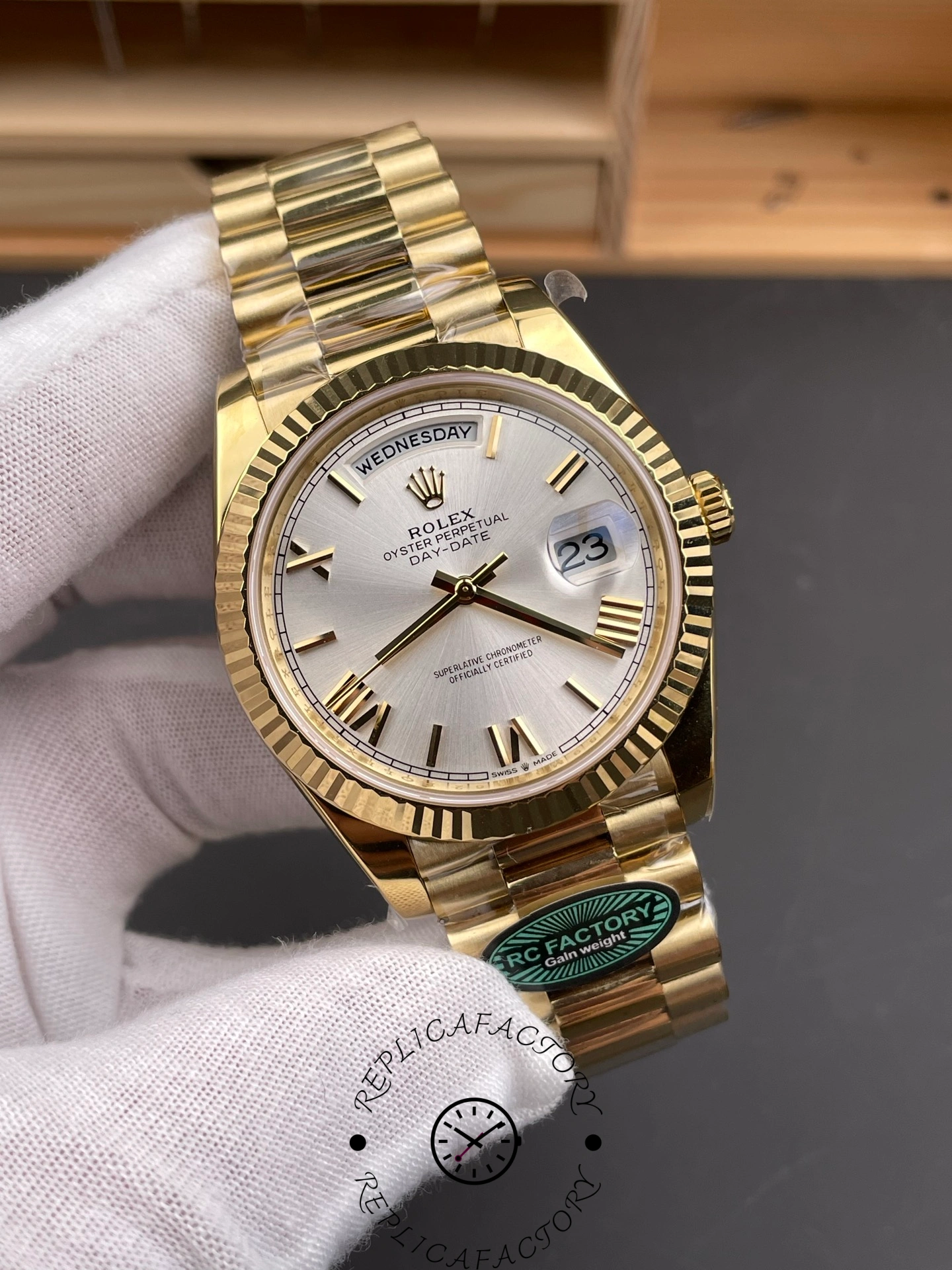 Angled front view of RC Factory Rolex Day-Date 228238 highlighting the fluted bezel and President bracelet.
