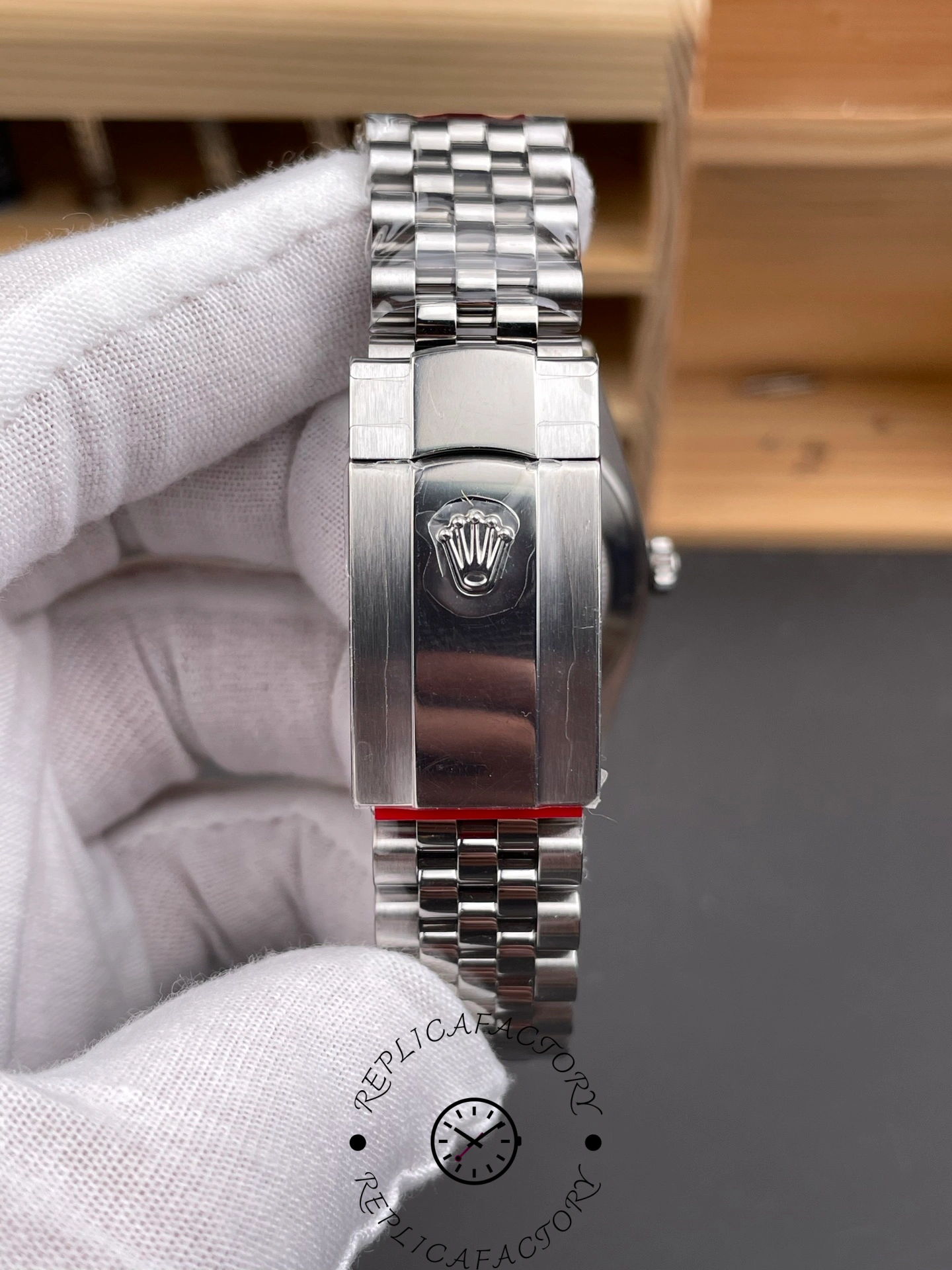 Clasp exterior of THB Factory Rolex Datejust 41 ref. 126334-0026 showing Rolex crown logo on Jubilee bracelet.