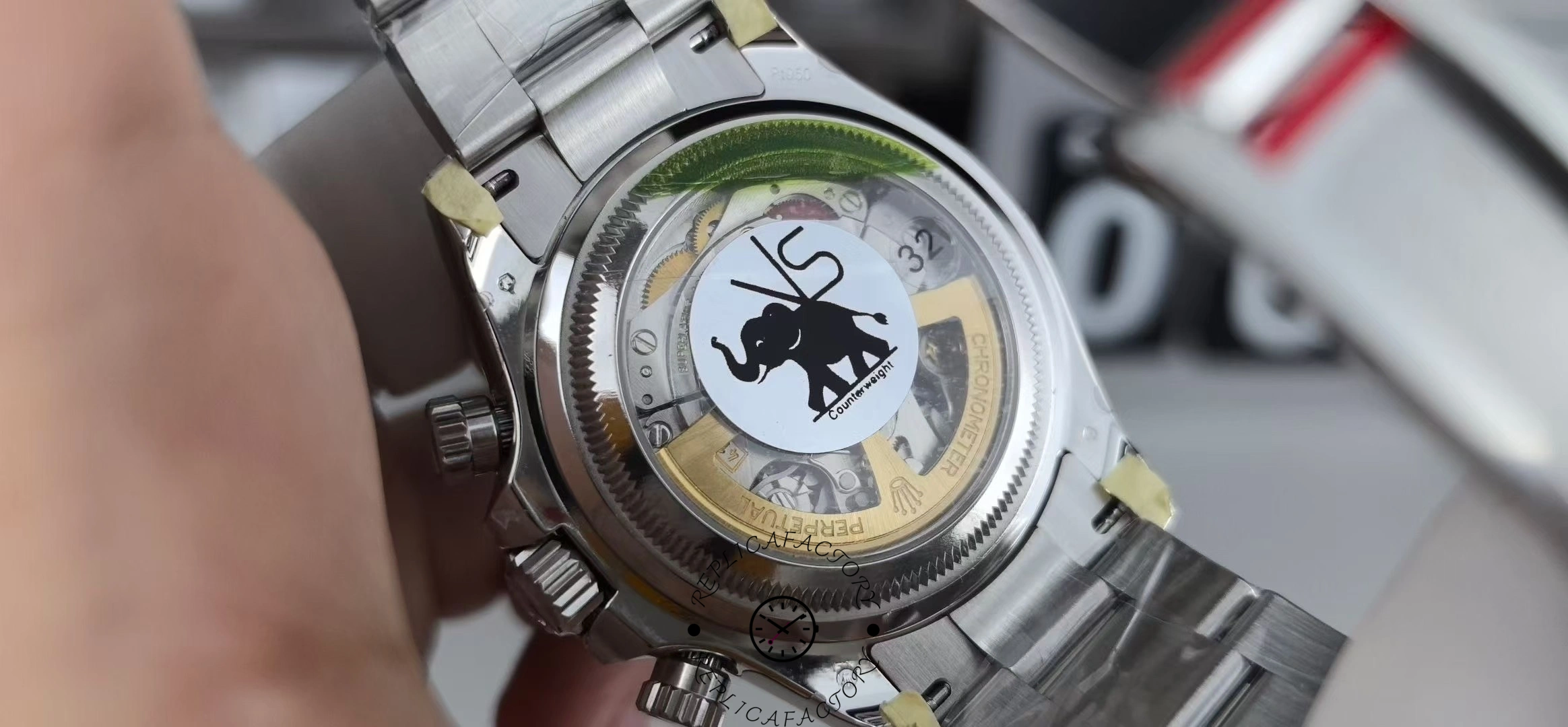 Caseback view of VS Factory Rolex Daytona 126506 showing VS elephant logo sticker and visible rotor.
