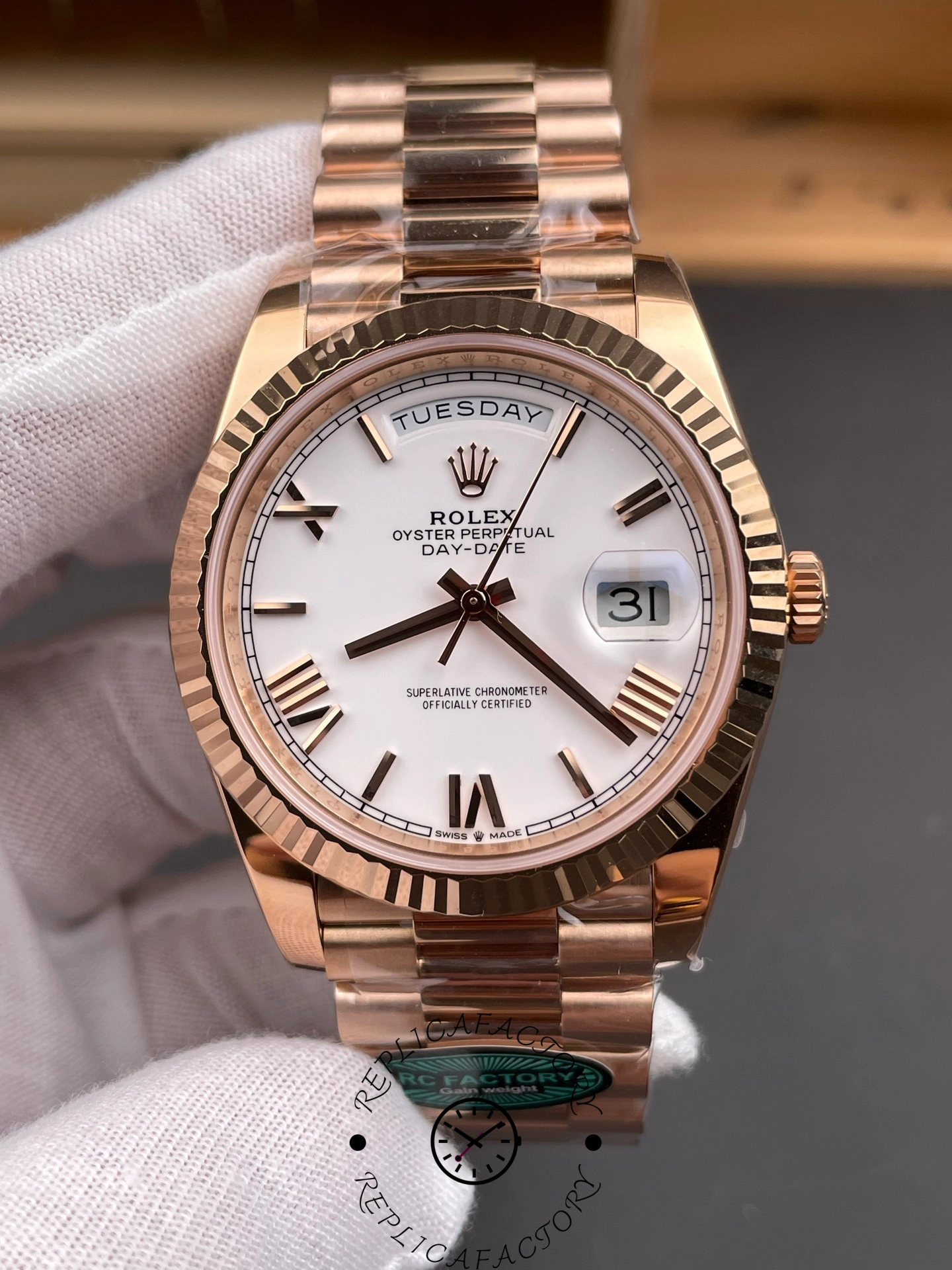 Close-up front shot of RC Factory Rolex Day-Date 228235 showing date and day windows.