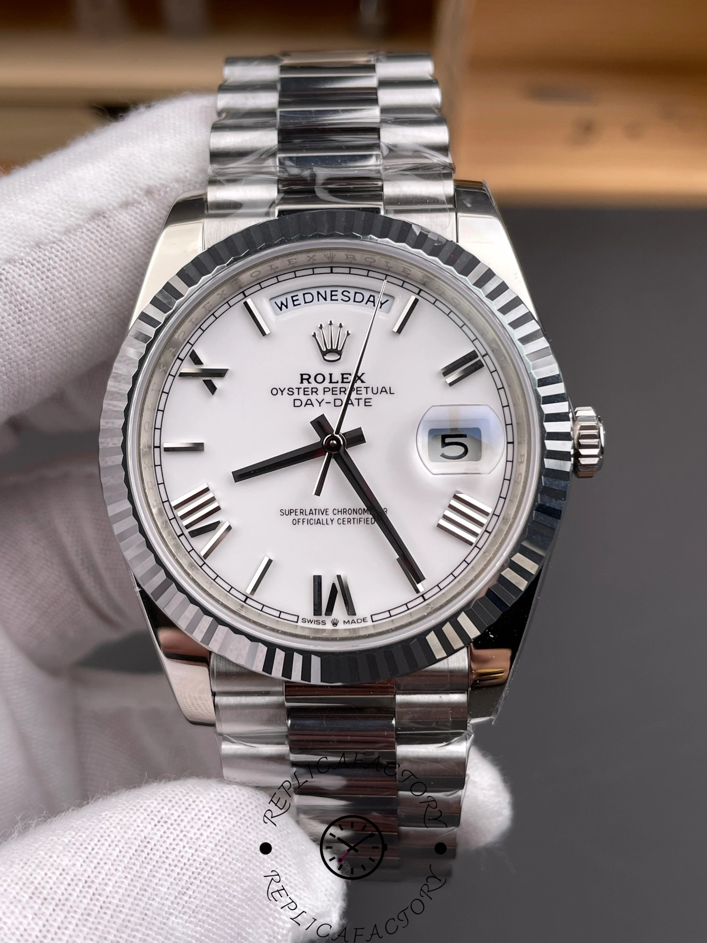 Close-up front shot of RC Factory Rolex Day-Date 228239 showing day and date display.