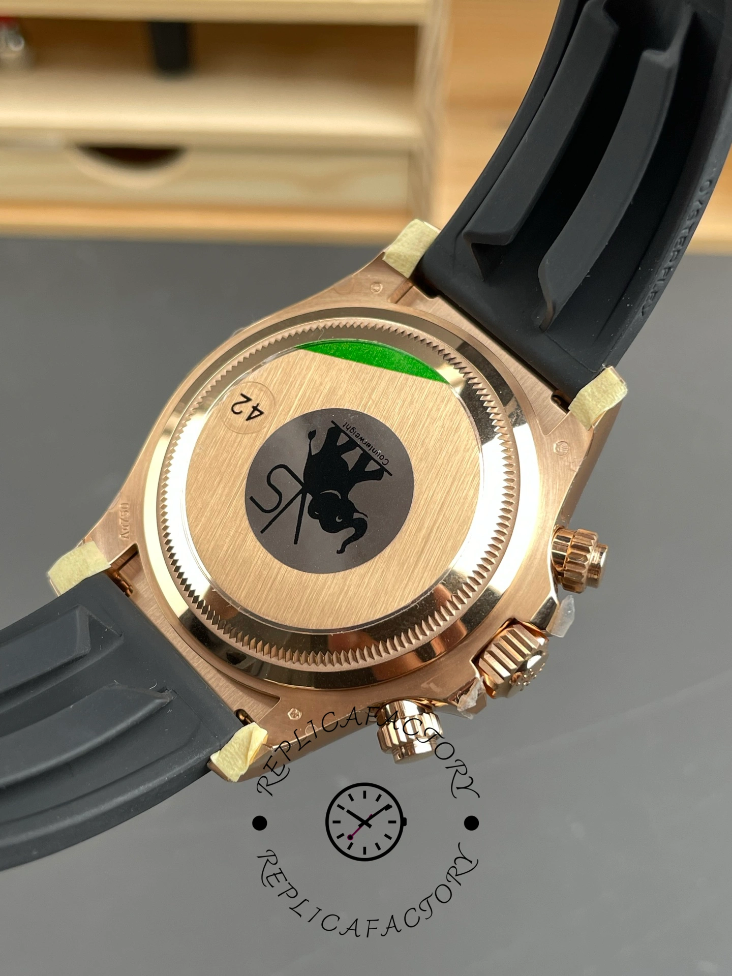 Caseback of ReplicaFactory Rolex Daytona 126515LN-0004 showing brushed Everose gold back with engraved crown logo.