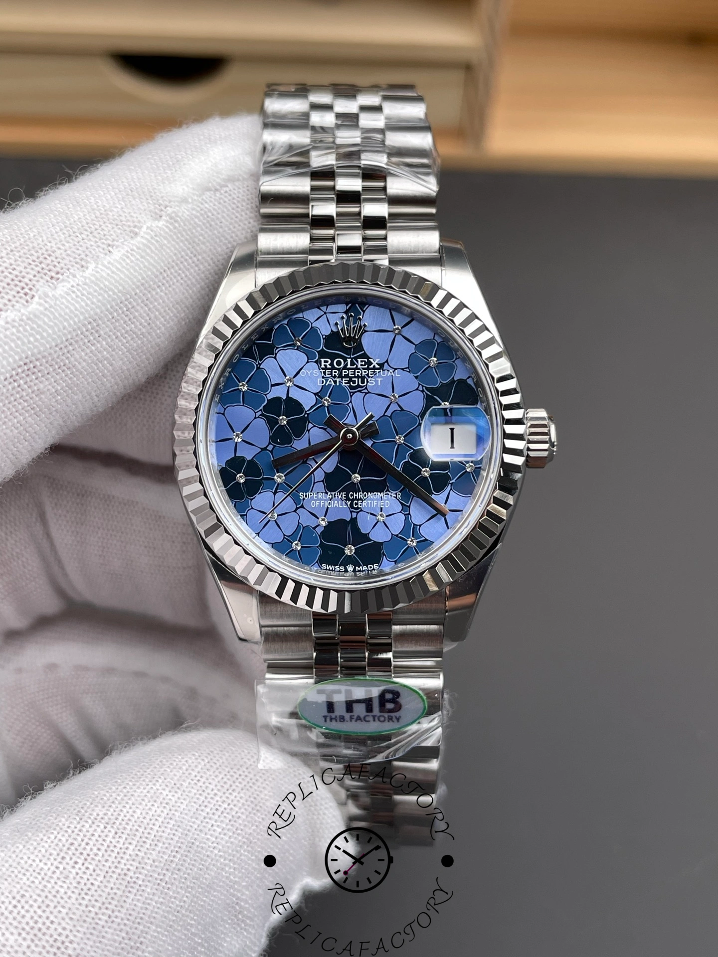 Close-up of THB Factory Rolex Datejust 31 ref. 278274-0036 highlighting the intricate floral dial pattern and date window at 3 o’clock.