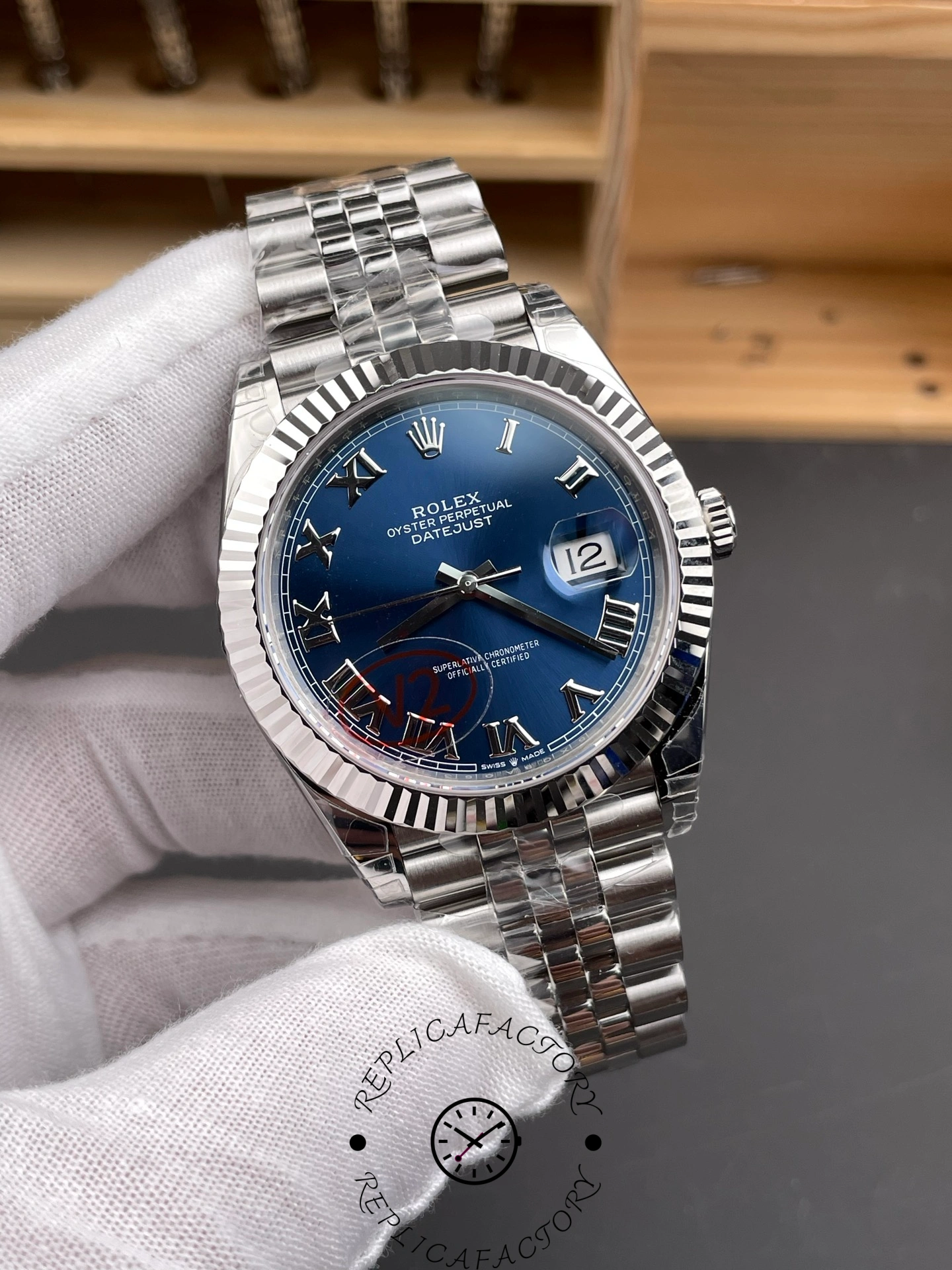 Angled view of THB Factory Rolex Datejust 41 ref. 126334-0026 showing reflective fluted bezel and Roman numerals.