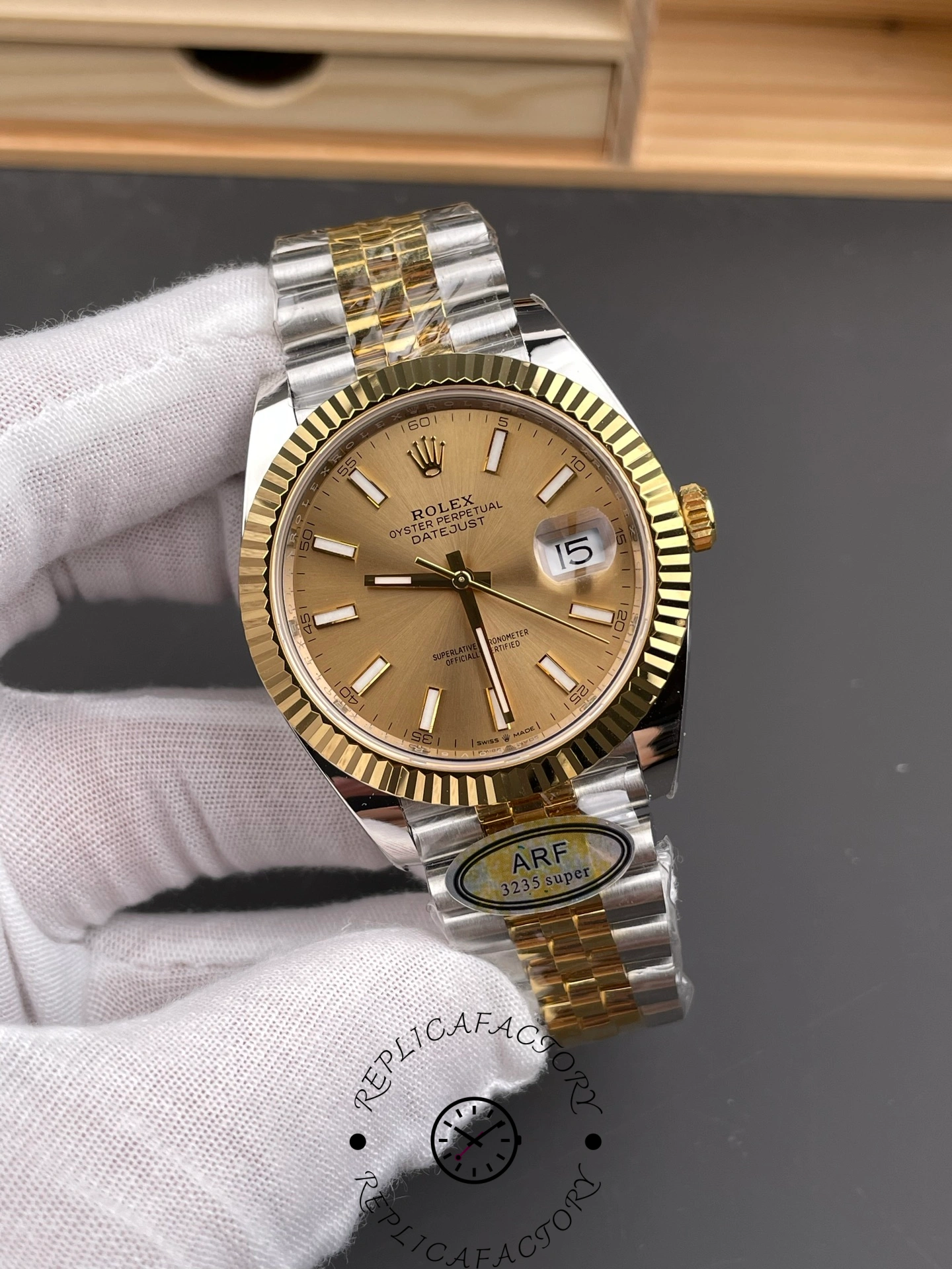 Angled front shot of ARF Factory Rolex Datejust 41 ref. 126333-0010 emphasizing polished yellow gold bezel and Jubilee bracelet shine.