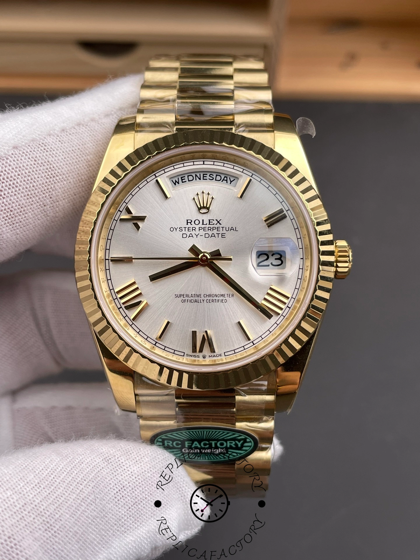Close-up front shot of RC Factory Rolex Day-Date 228238 showing day and date windows clearly.