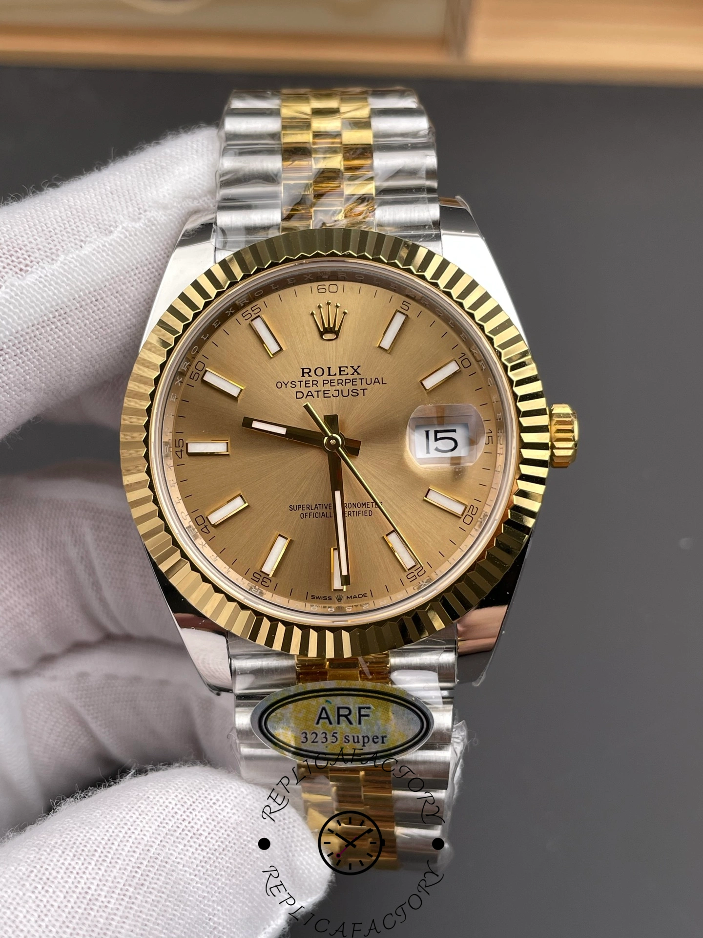 Close-up of ARF Factory Rolex Datejust 41 ref. 126333-0010 highlighting the champagne sunburst dial texture and baton hour markers.