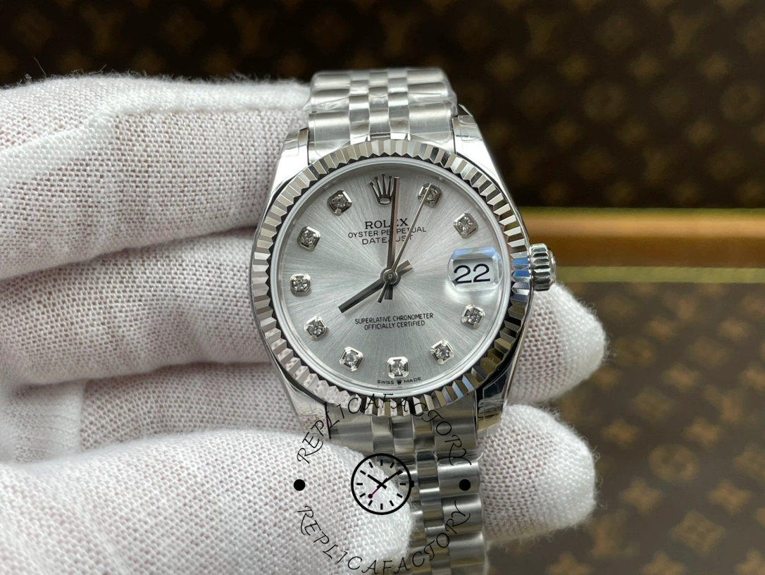 Front view of ReplicaFactory Rolex Datejust m278274-0030 showing silver dial and fluted white gold bezel.