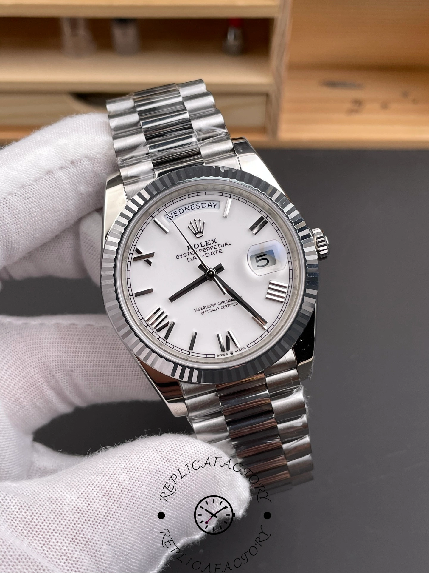 Angled front view of RC Factory Rolex Day-Date 228239 highlighting fluted bezel and President bracelet.