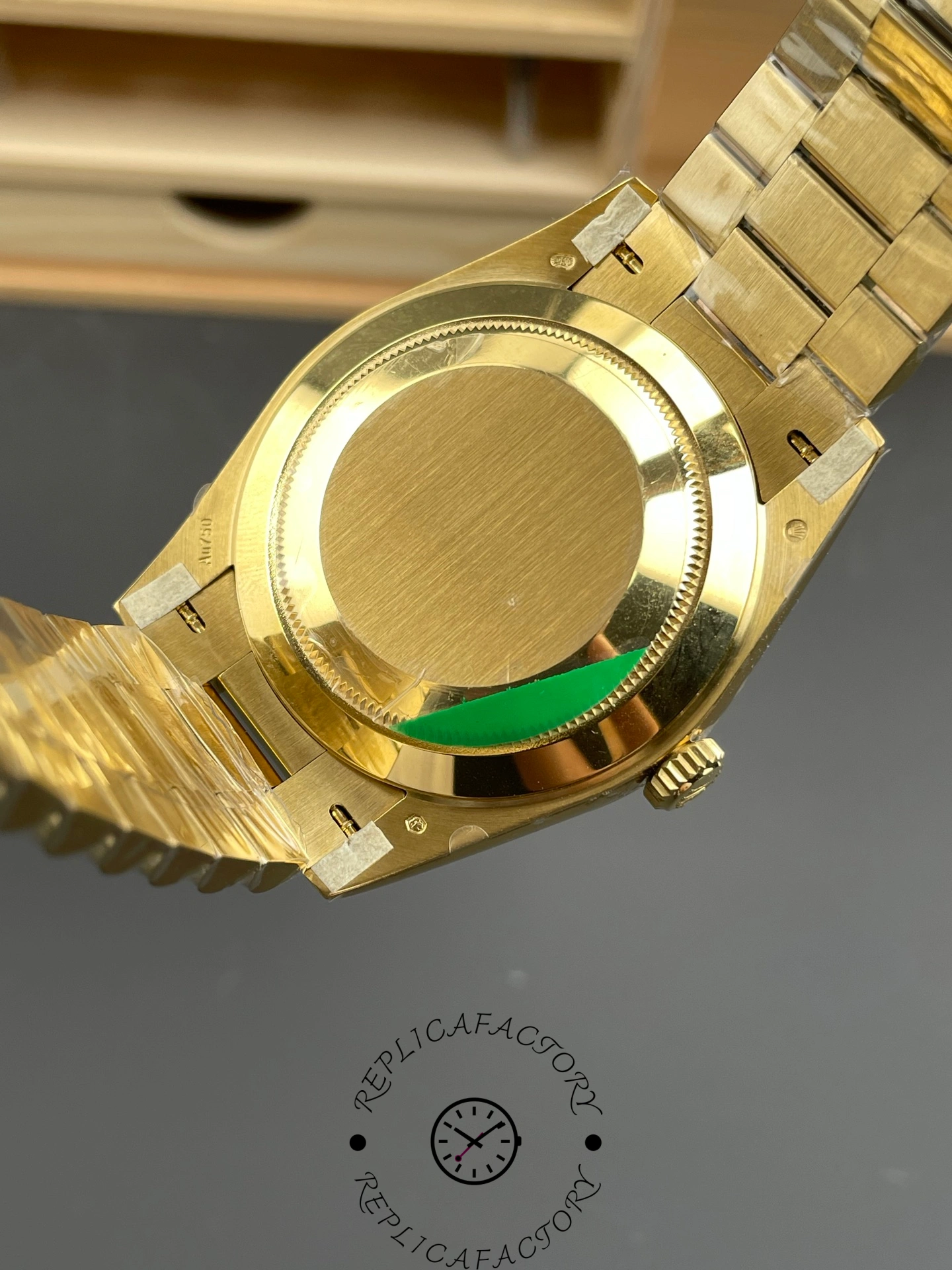 Rear view of Rolex Day-Date 228238 showing the case back and bracelet attachment.