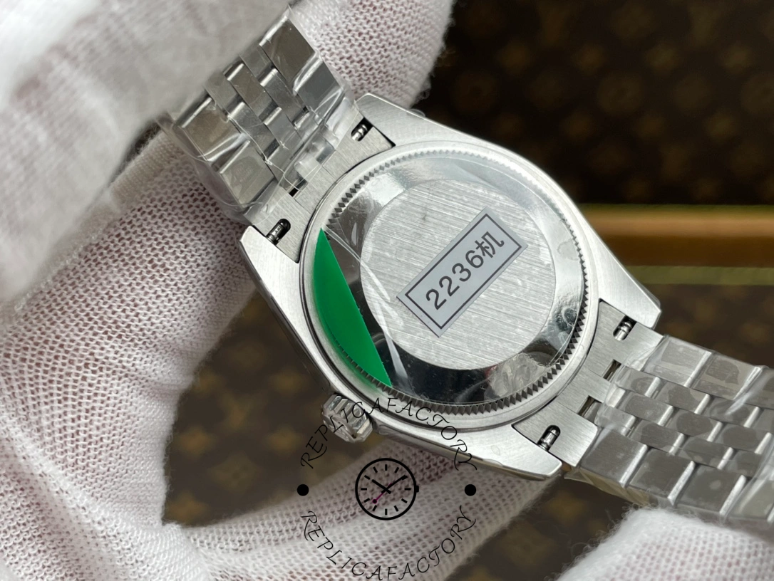 Caseback of ReplicaFactory Rolex Datejust m278274-0030 showing 2236 movement marking on protective sticker.