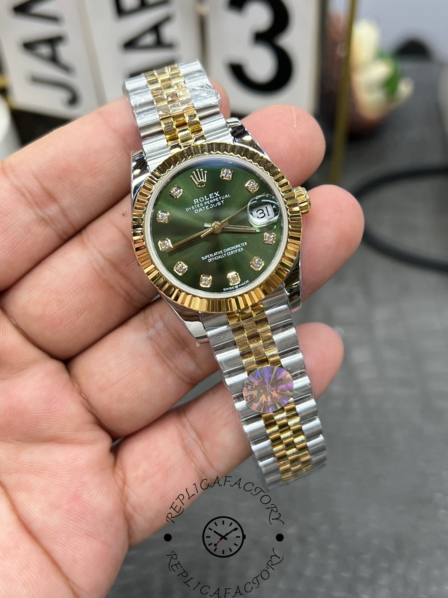 Macro view of ReplicaFactory Rolex Datejust 31mm 278273-0030 showing dial texture and date window with Cyclops lens.