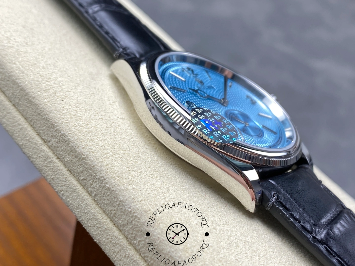 Angled side view of Rolex Perpetual 1908 52506-0003 with ice blue dial and domed bezel.