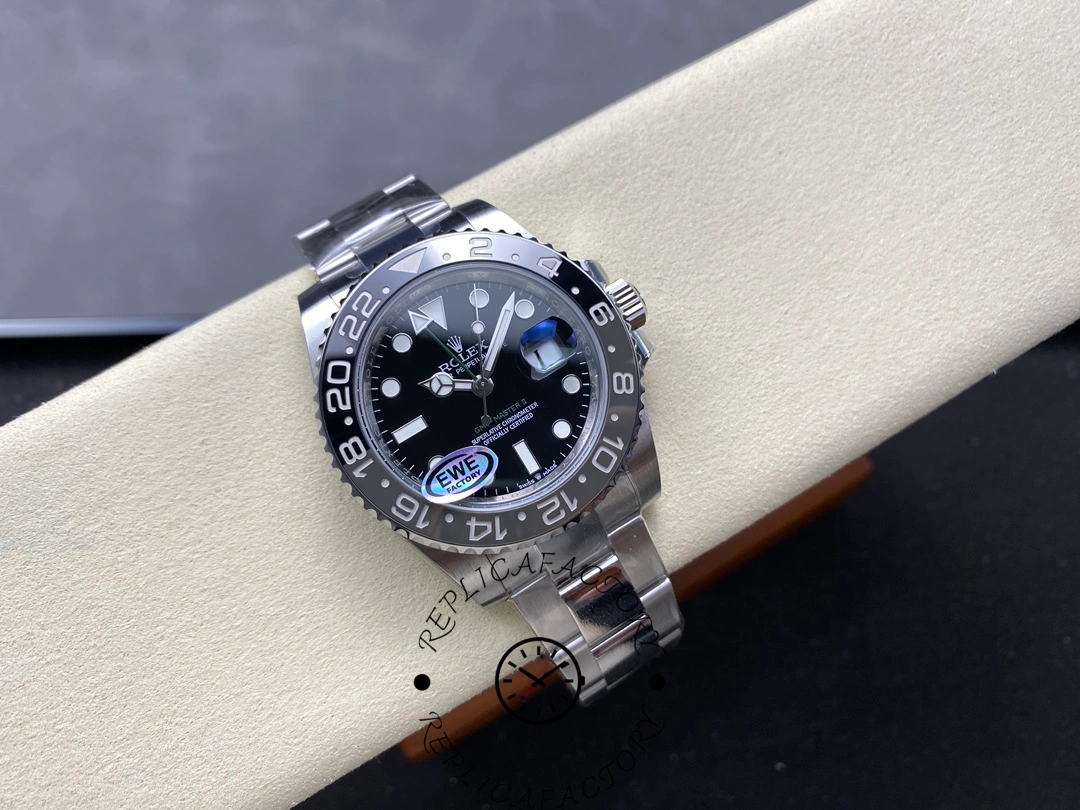Full view of Rolex GMT-Master II M126710GRNR-0004 on display cushion.
