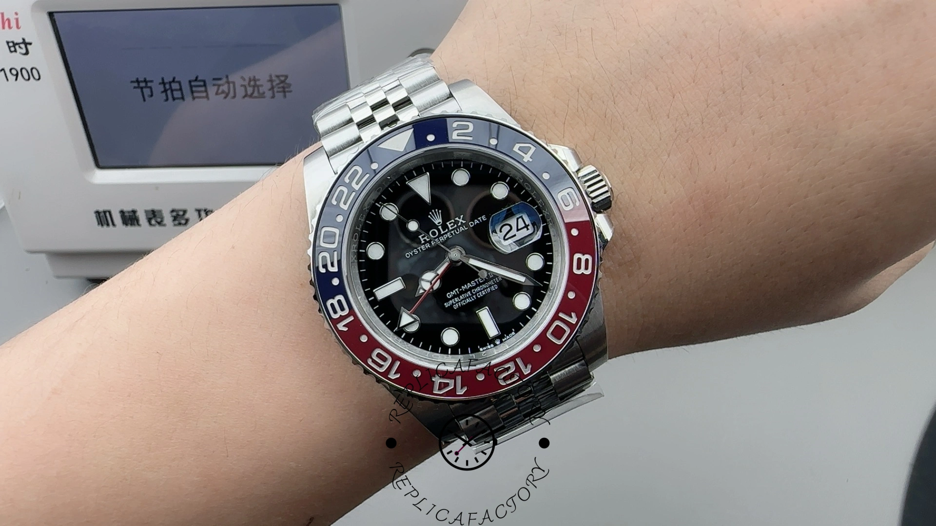 Wrist-shot of Rolex GMT-Master II 126710BLRO on hand showing full watch and Pepsi bezel.