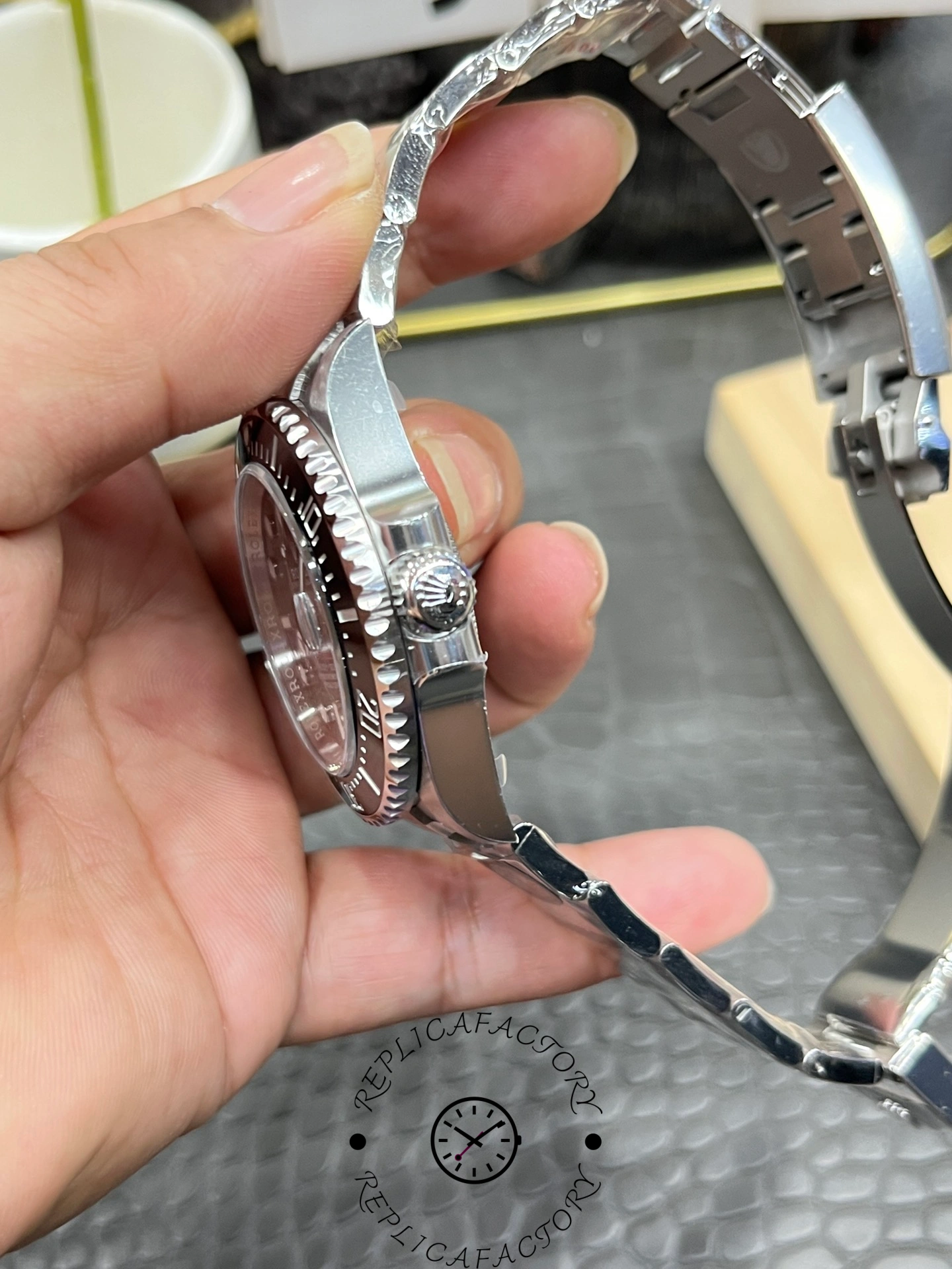 Side profile of Rolex Sea-Dweller 126600-0002 showing screw-down crown and thick case design.