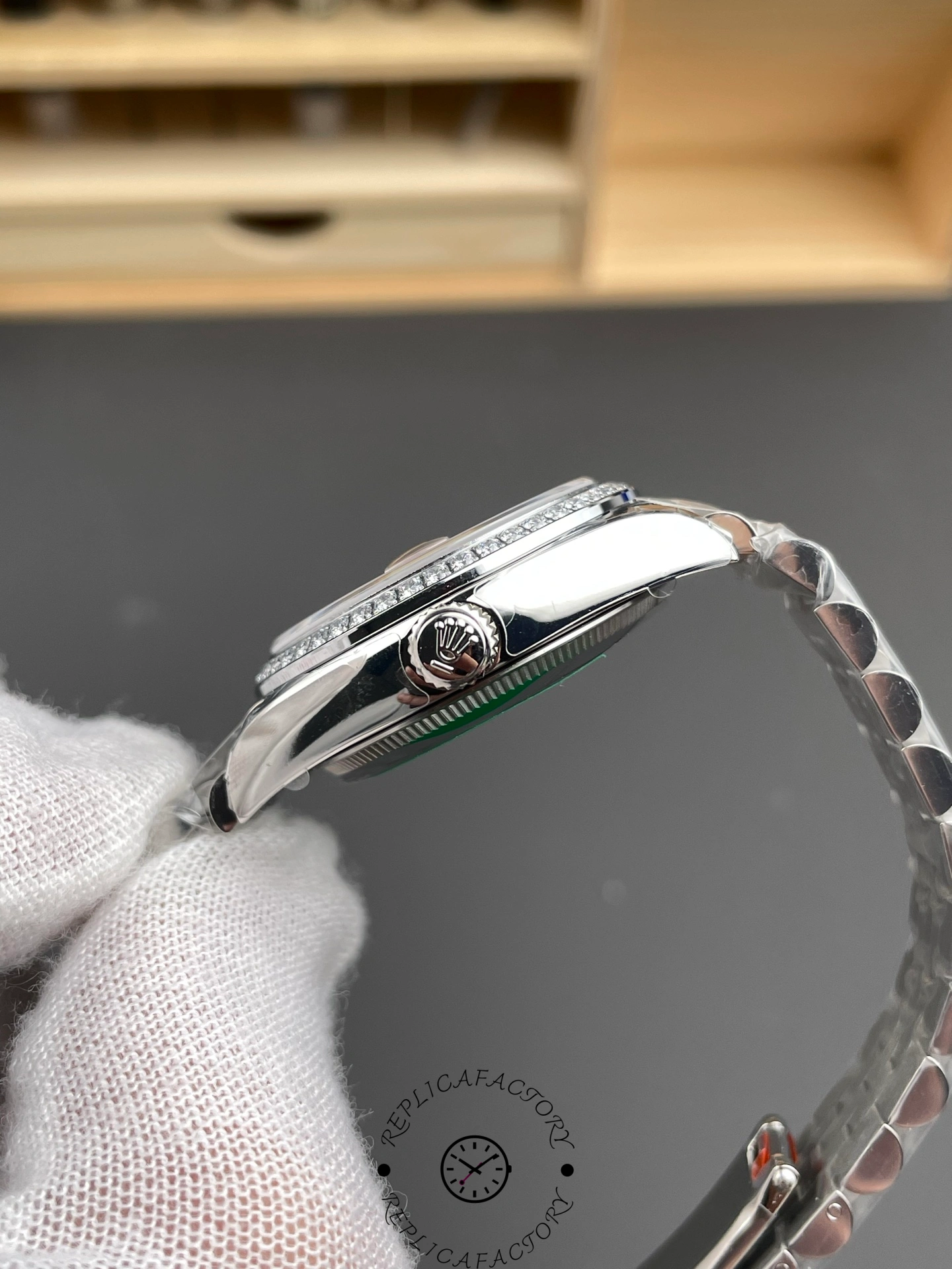 Side view of Rolex Datejust 31 m278384rbr 0036 showing crown and slim polished case.