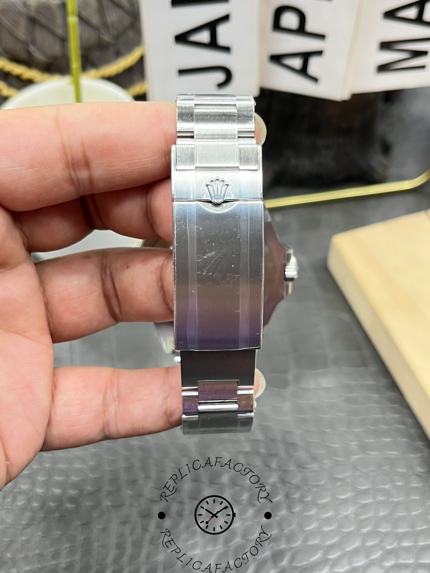 Rolex Sea-Dweller 126600-0002 clasp view showing engraved Rolex crown logo.