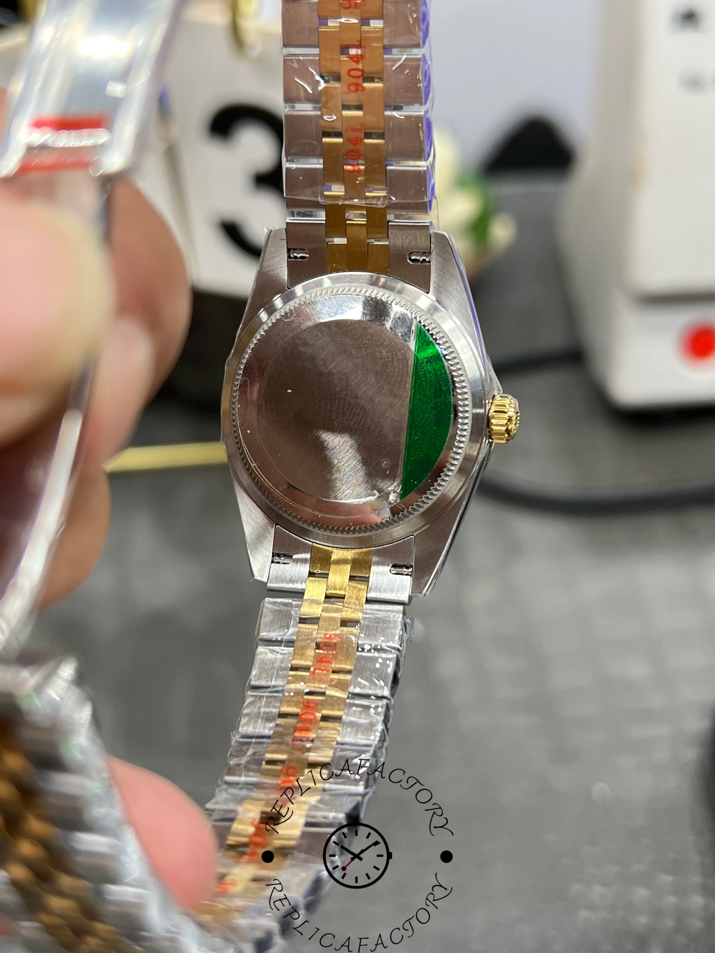 Caseback of ReplicaFactory Rolex Datejust 31mm 278273-0030 showing brushed steel back with green seal.