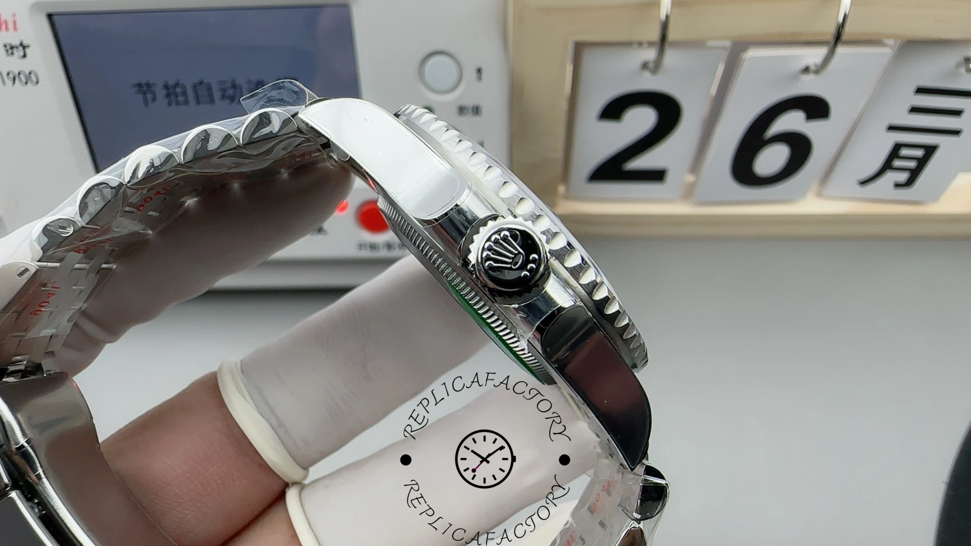 Side view of Rolex GMT-Master II 126710BLRO showing crown with Rolex logo and polished case.