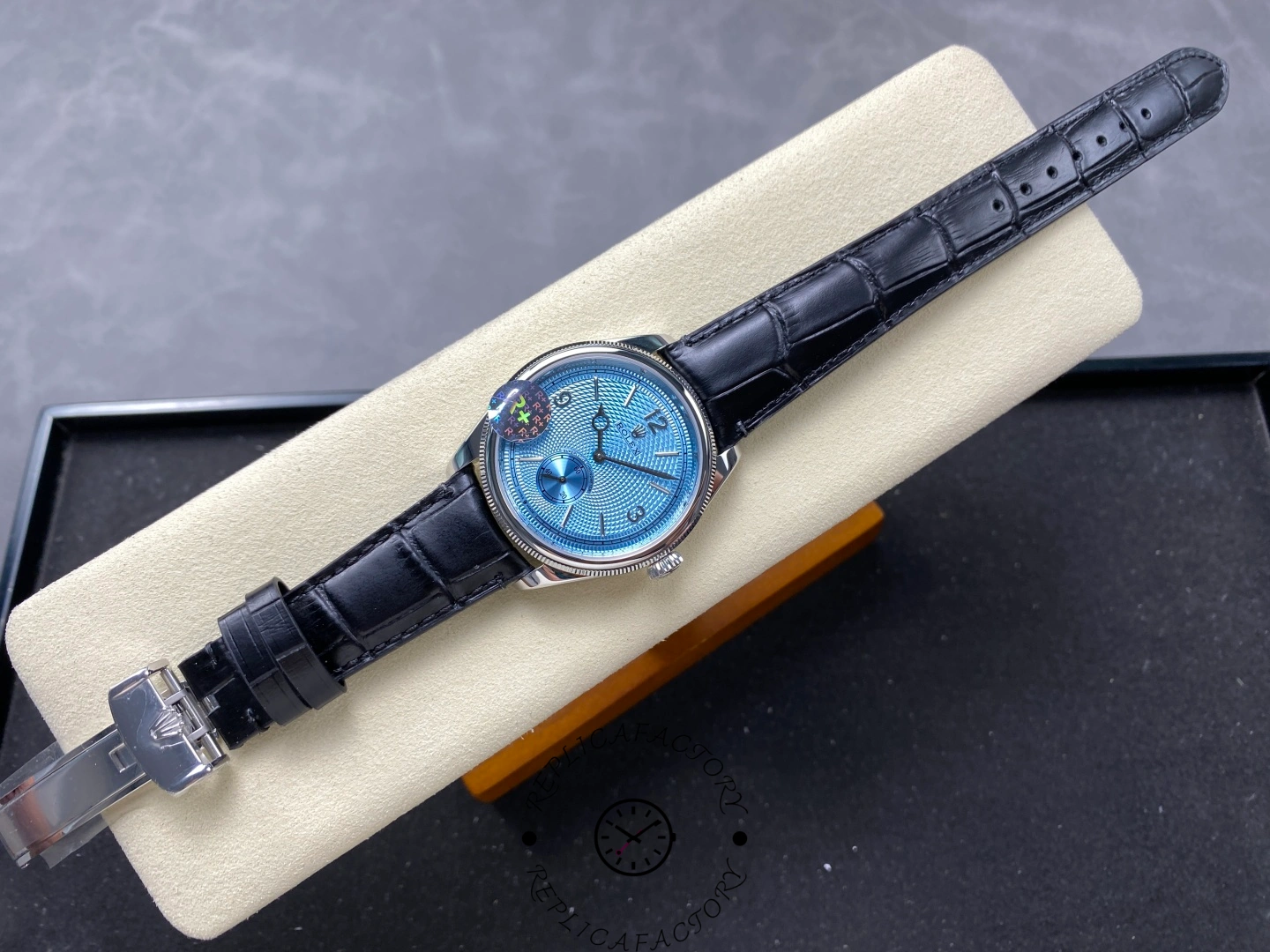 Full view of Rolex Perpetual 1908 52506-0003 with black leather strap and ice blue dial.