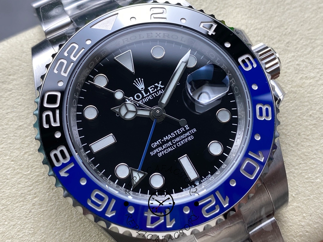 Close-up of Rolex GMT-Master II 116710BLNR showing bezel numerals and cyclops lens.