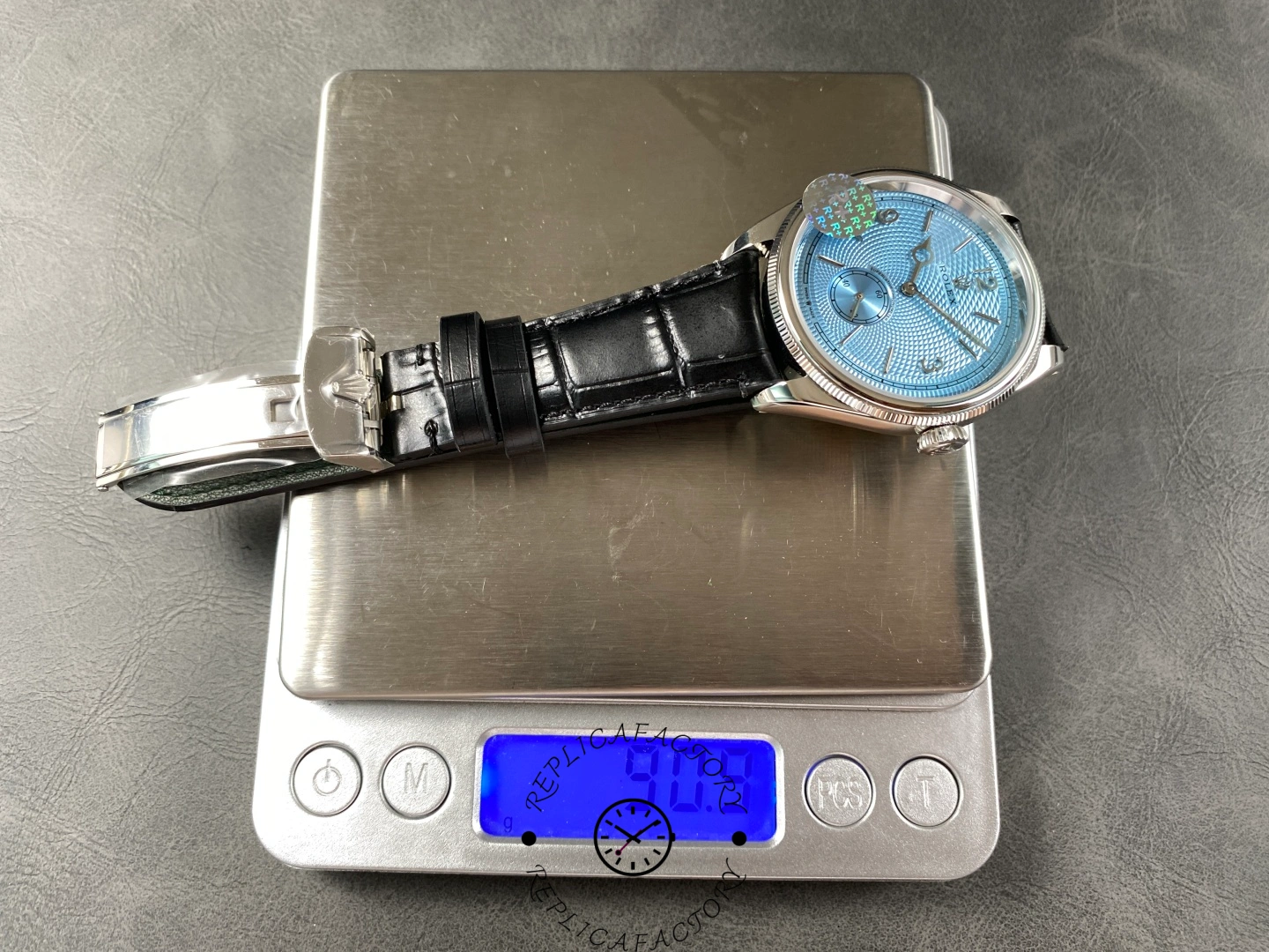 Rolex Perpetual 1908 52506-0003 on scale showing total watch weight in grams.