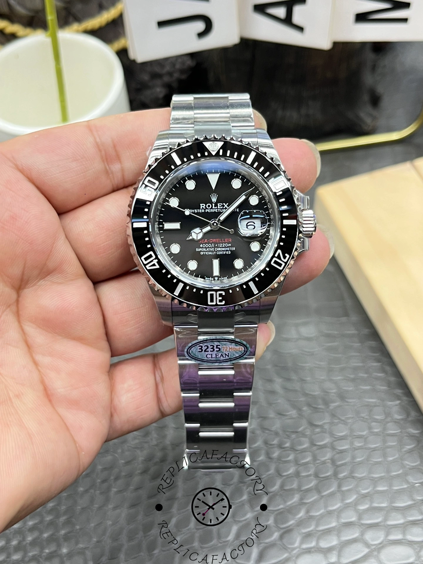 Real photo of Rolex Sea-Dweller 126600-0002 showing black dial and date magnifier at 3 o’clock.