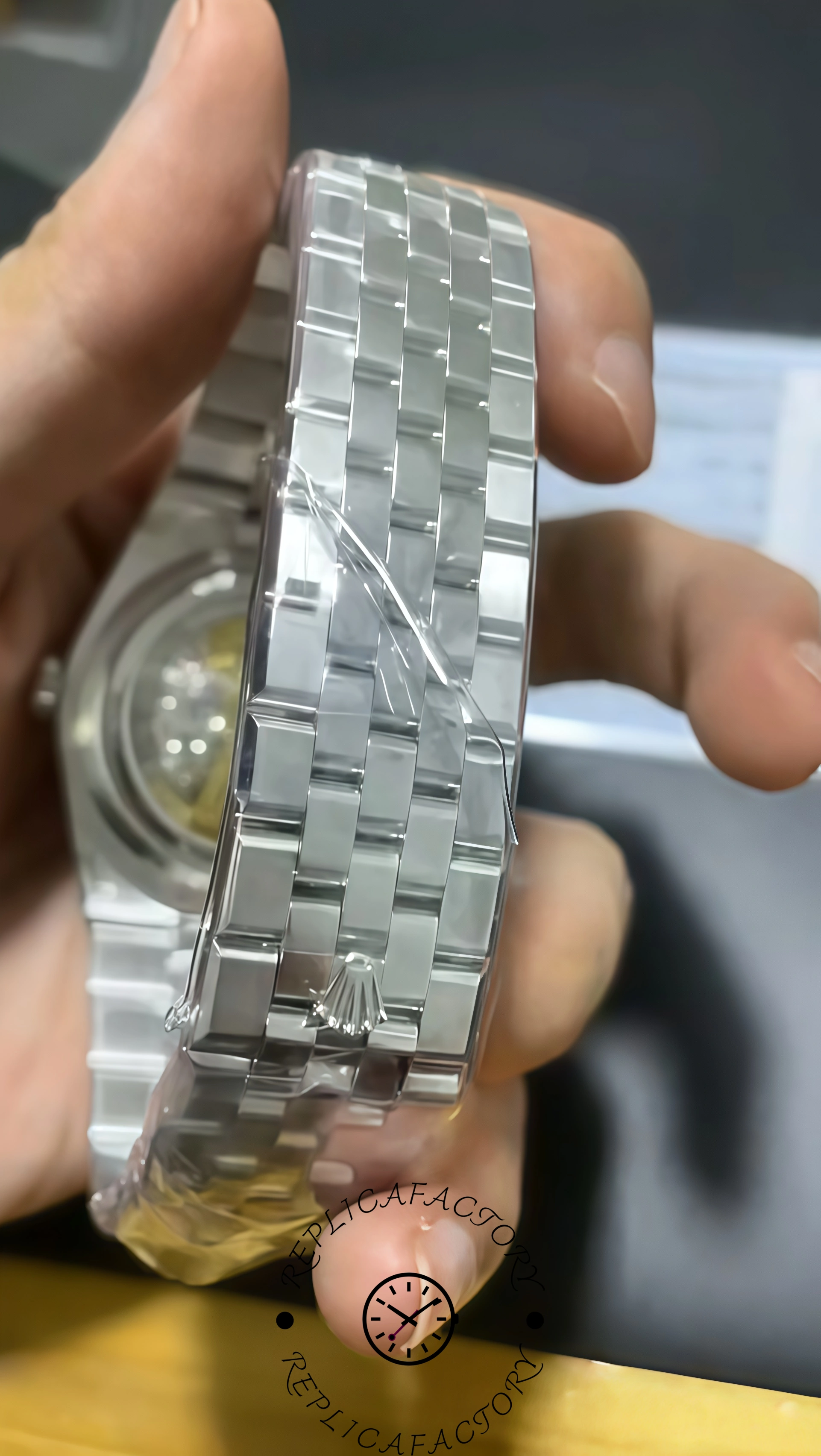 Back view of Rolex Land-Dweller 40 platinum bracelet with Rolex crown clasp.