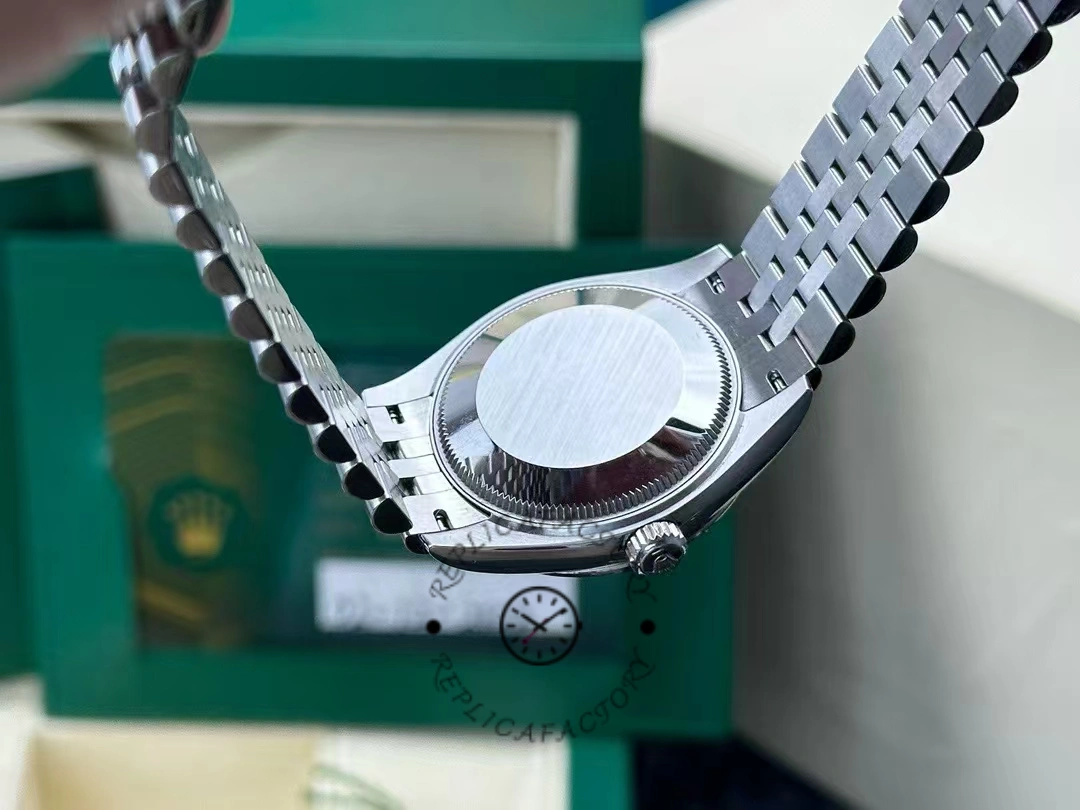 Caseback photo of Rolex Datejust 31mm 278274-0018 after 2 years of real wear, showing brushed steel back and crown detail