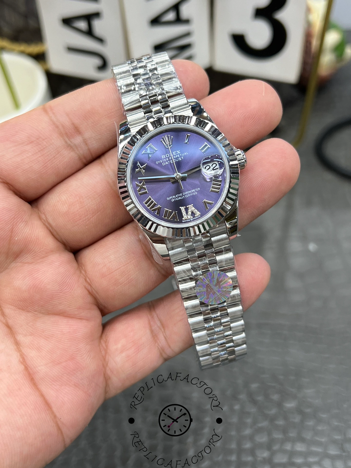 Angled view of ReplicaFactory Rolex Datejust 31mm 278274-0026 highlighting Roman numerals and diamond-set VI marker.