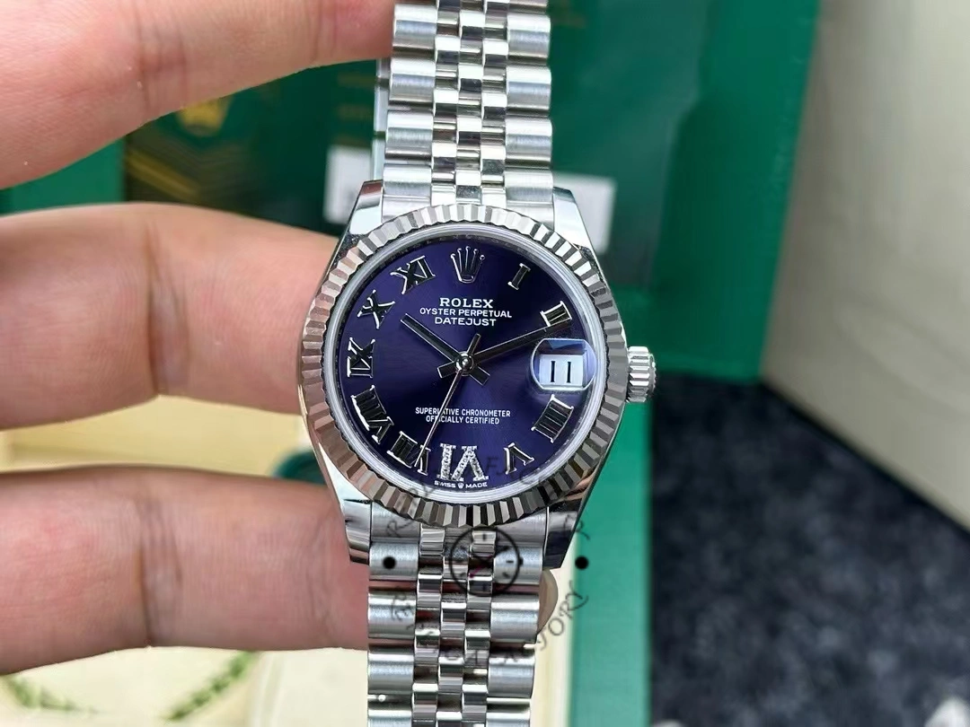 Real photo of Rolex Datejust 31 reference 278274-0018 with blue dial and diamond VI marker after 2 years of customer use, showing excellent condition and shine