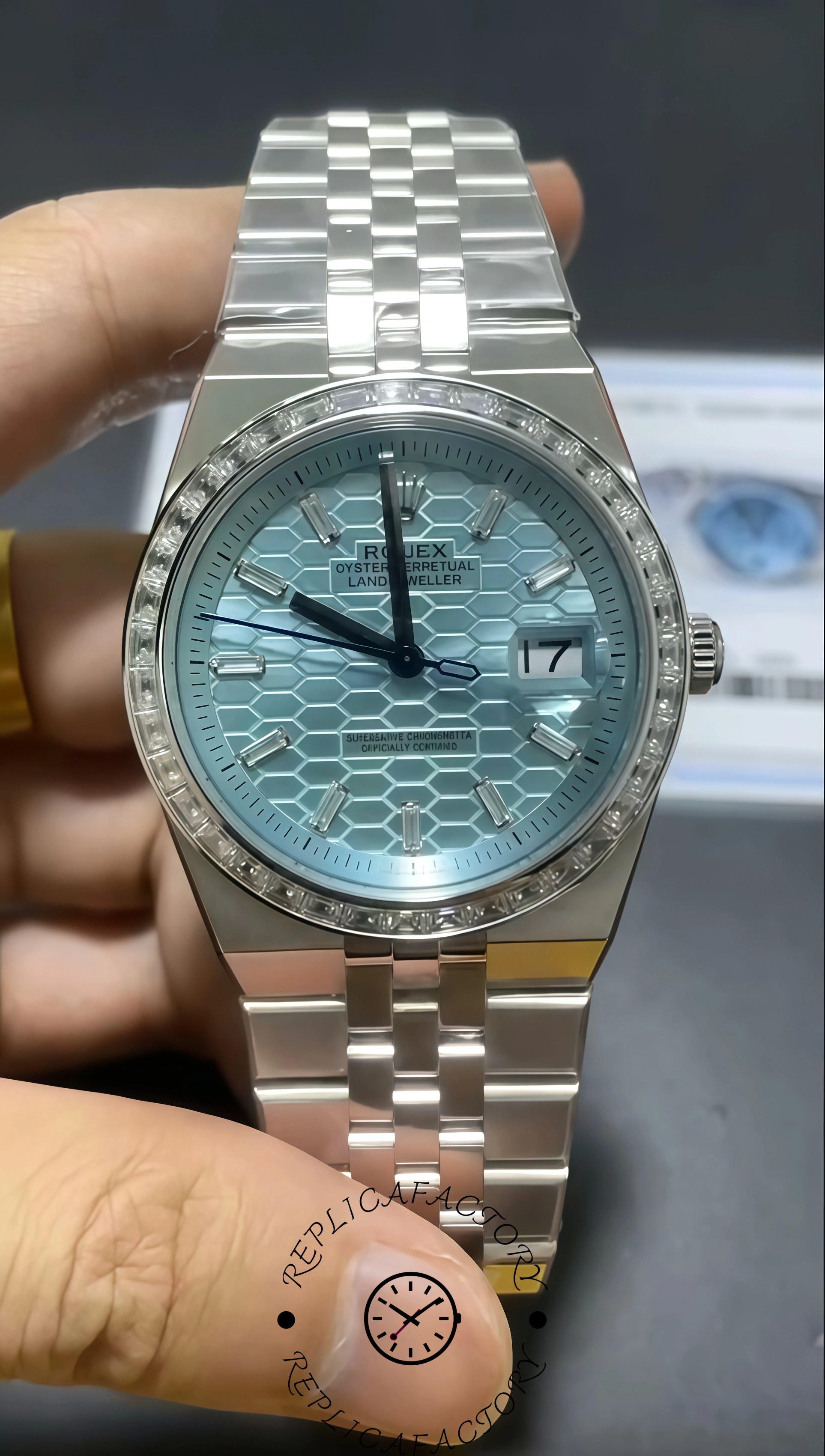 Real photo of Rolex Land-Dweller 40 showing platinum case and baguette diamond bezel.