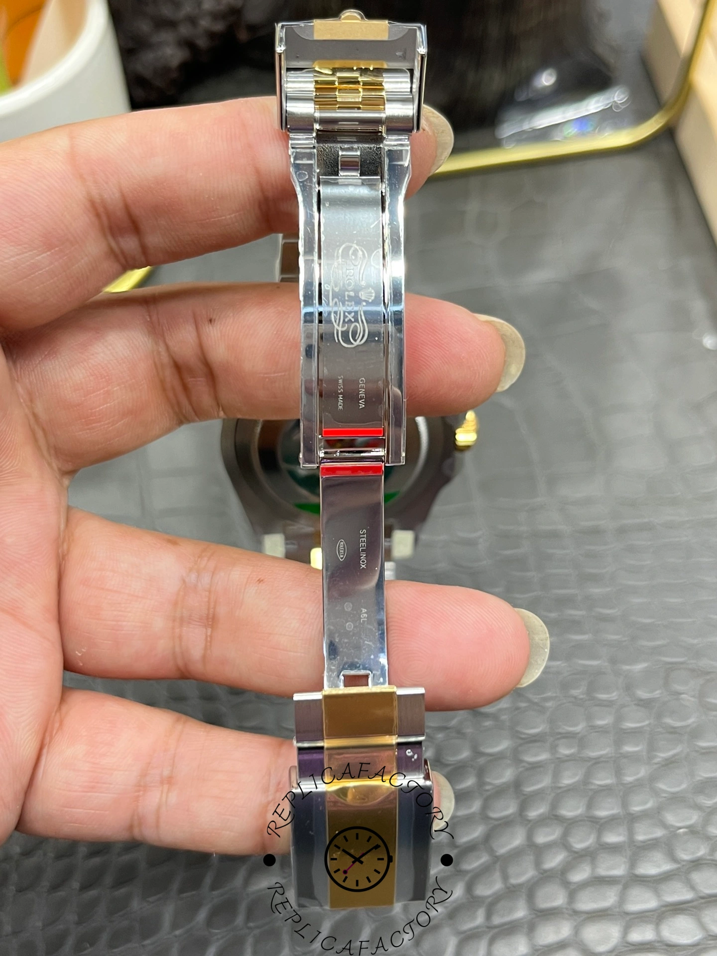 Inside clasp of Rolex GMT-Master II 126713GRNR-0001 showing polished finish and engravings.