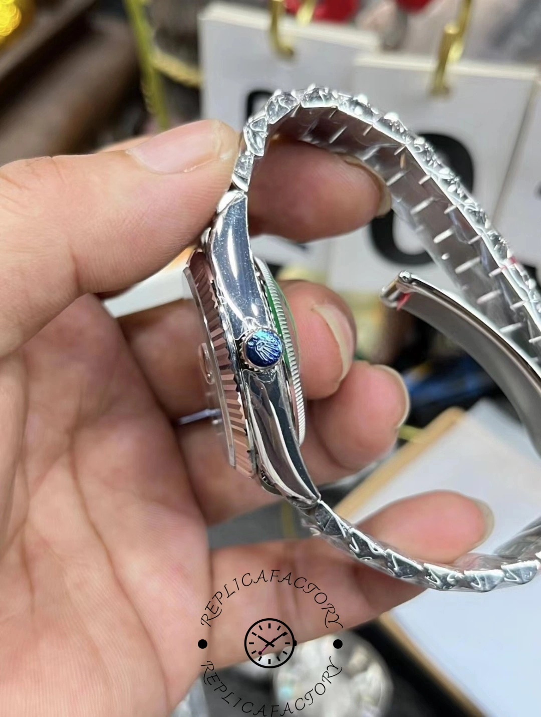 Rolex Day-Date 36mm cherry red dial wristwatch front angled view