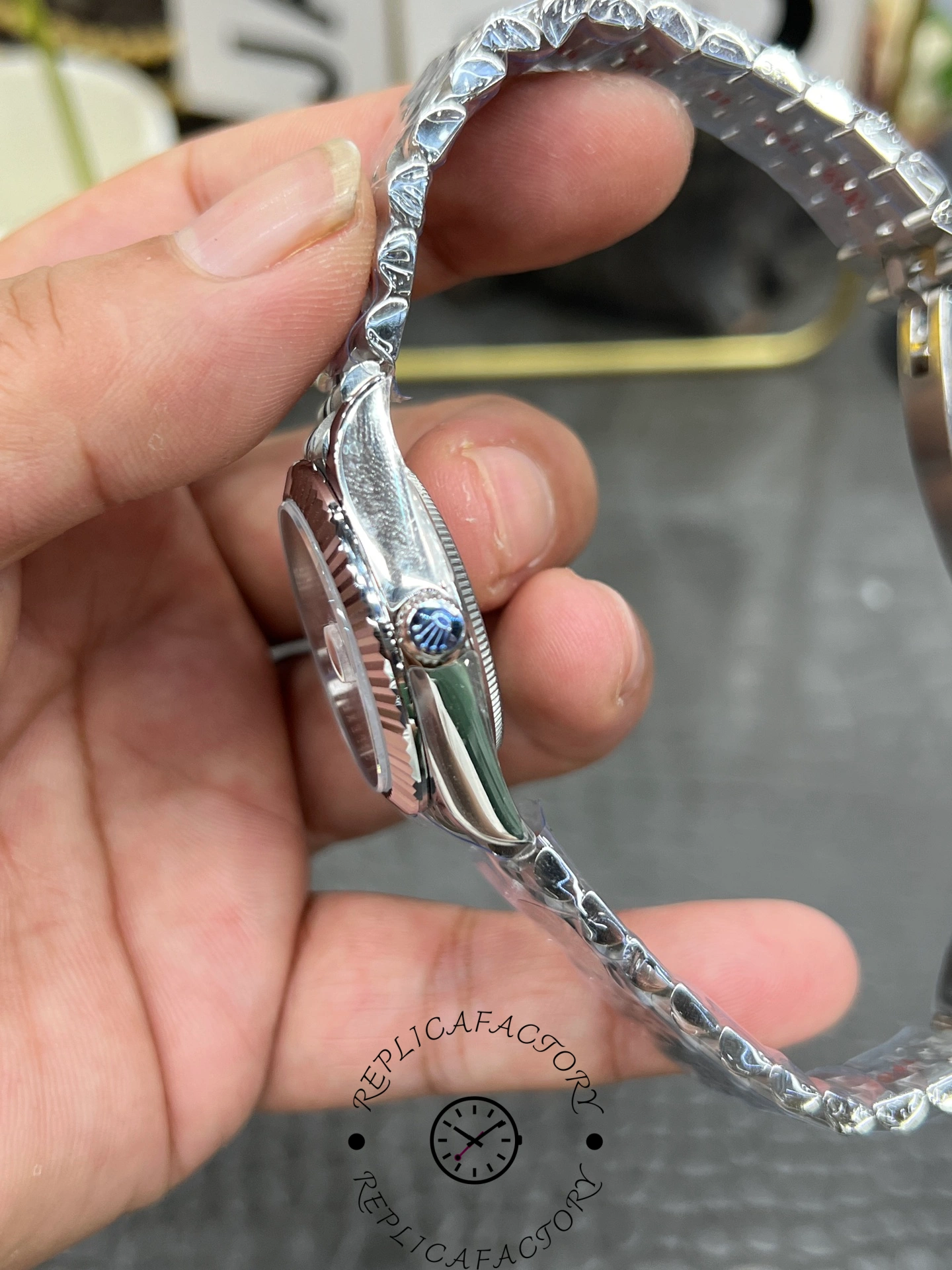 Side profile of ReplicaFactory Rolex Datejust 31mm 278274-0026 showing fluted bezel edge and screw-down crown.