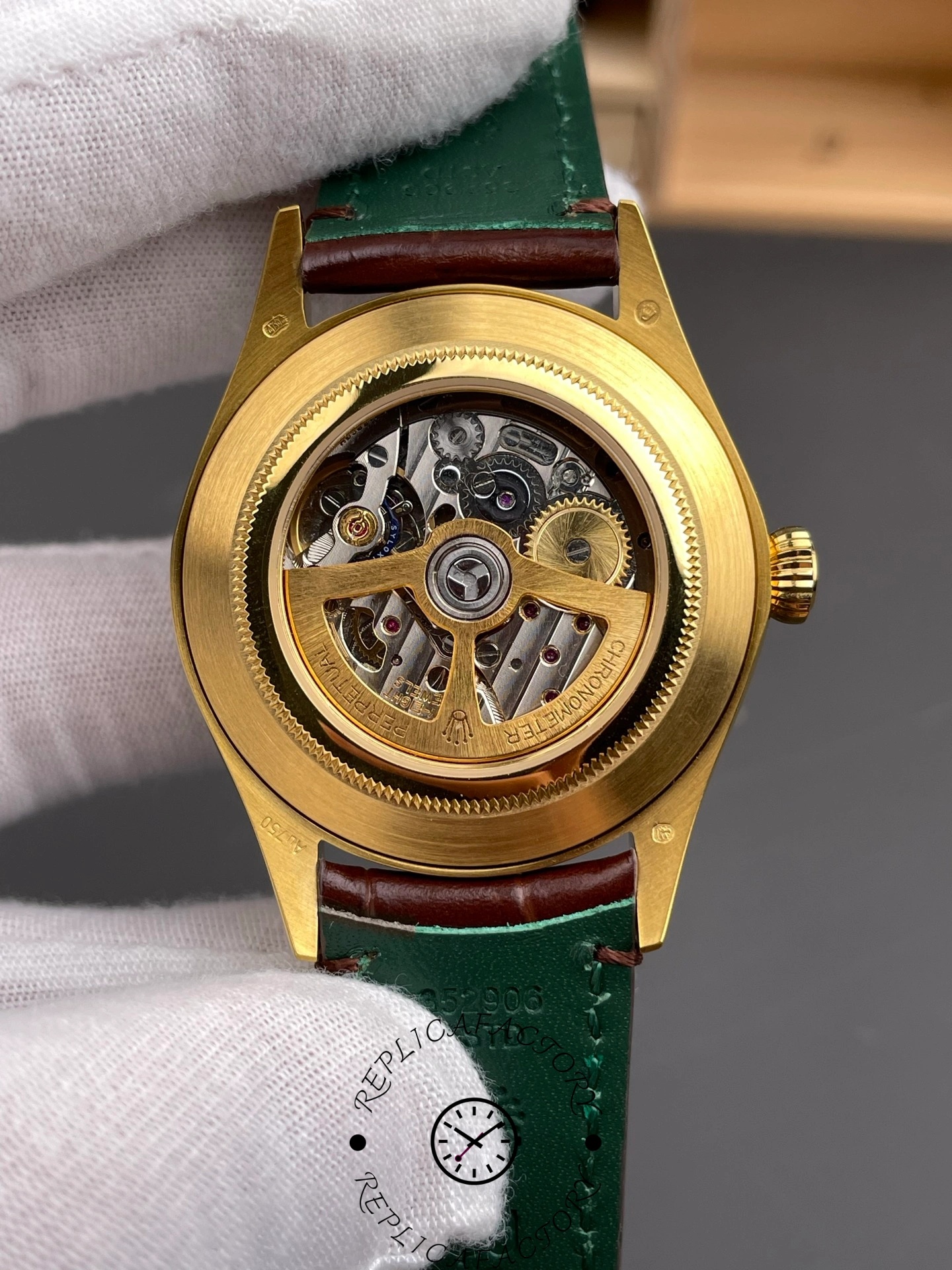 Caseback of Rolex 1908 52508 showing exhibition back and automatic movement.