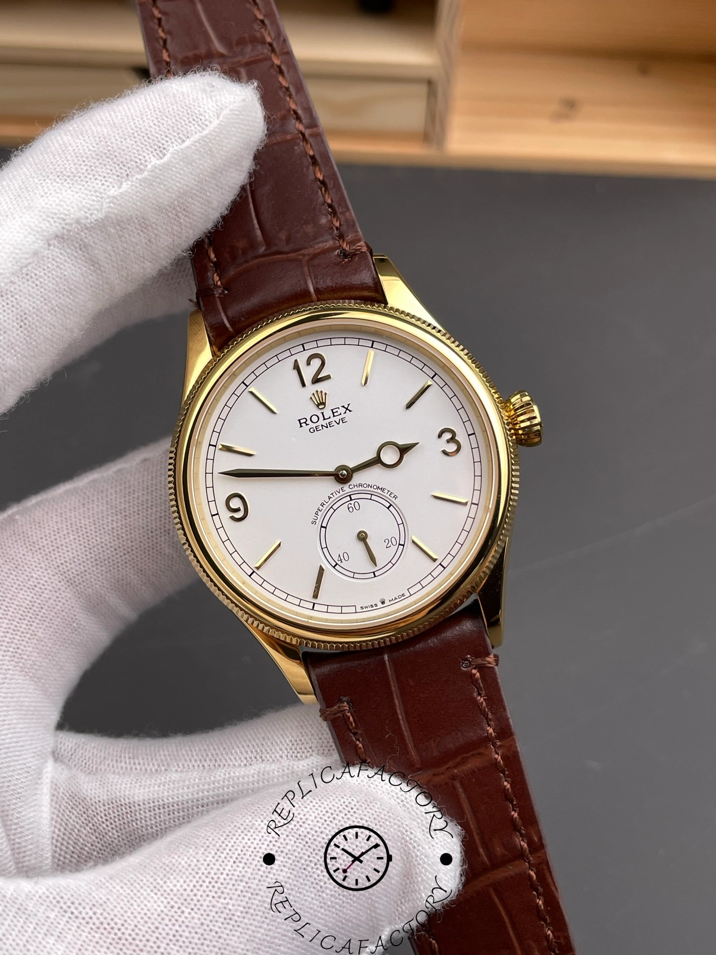 Angled front view of Rolex 1908 52508 highlighting domed crystal and gold fluted bezel.